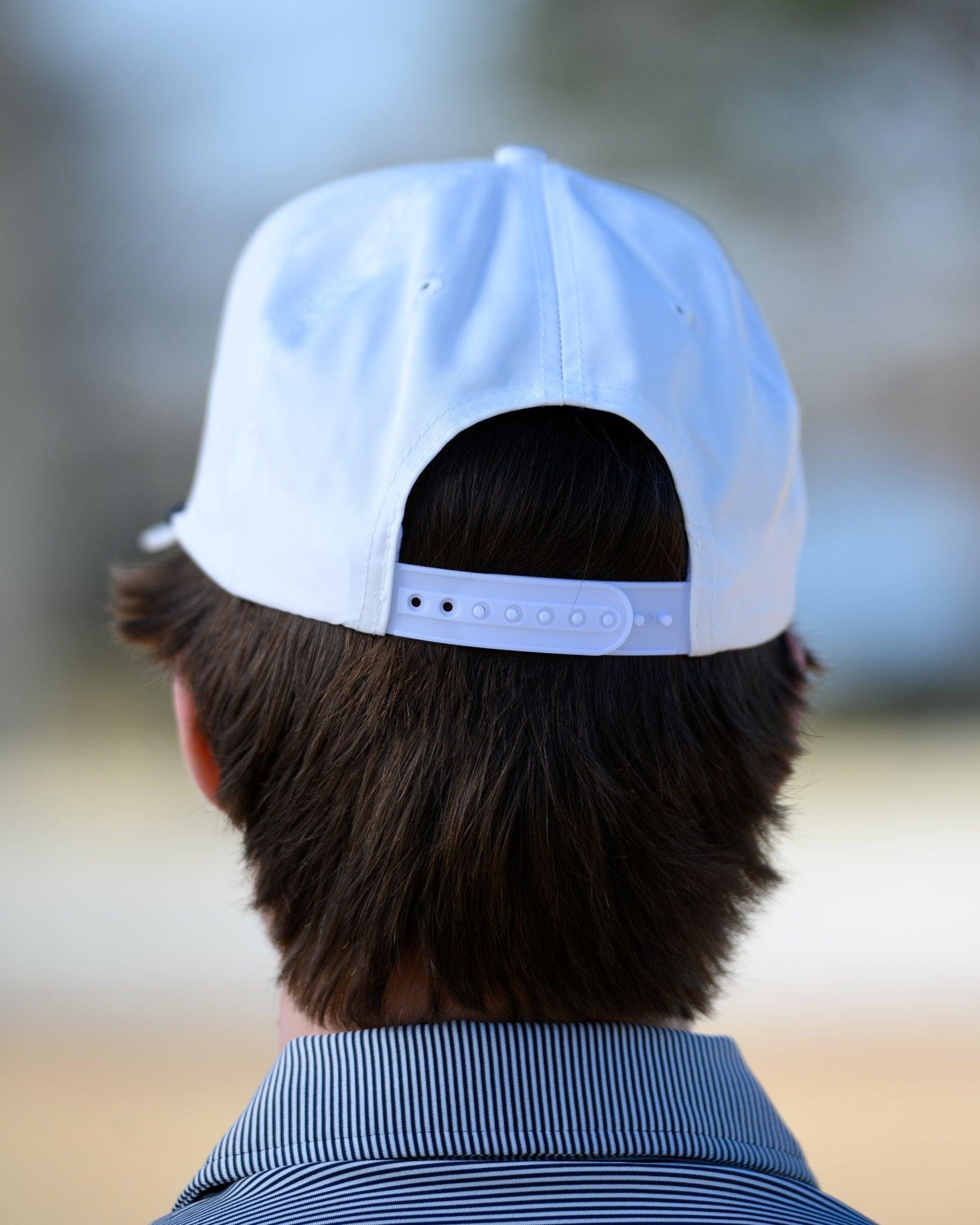 Auburn University White Rope Hat with a Blue rope and Orange "Auburn" embroidery with a golf flag at the end.
Snapback Hat