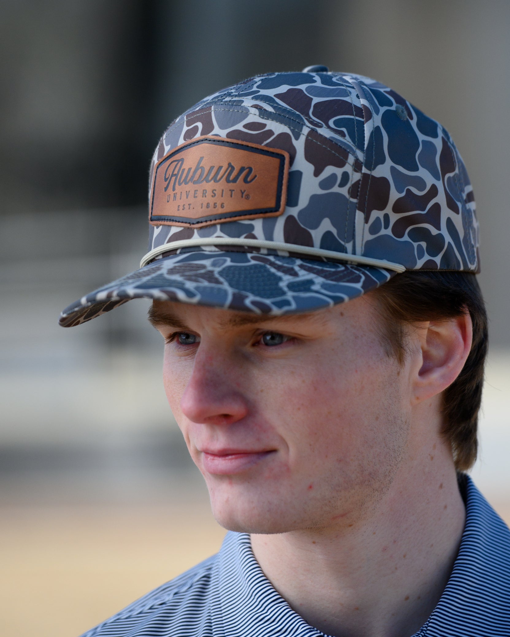 Auburn University Auburn Leather Patch Hat Duck Camo JNJ 7-Panel Hat with White rope and Leather patch with text "Auburn University"