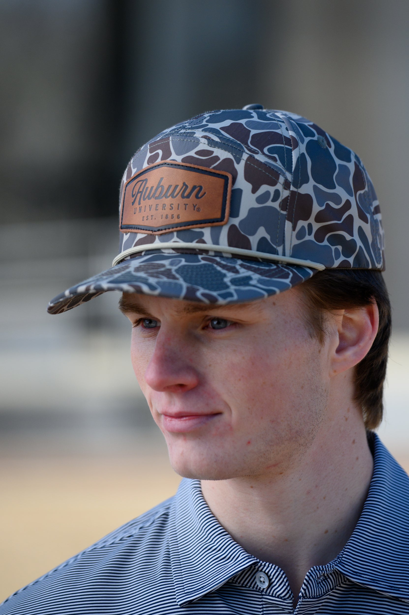 Auburn University Auburn Leather Patch Hat Duck Camo JNJ 7-Panel Hat with White rope and Leather patch with text "Auburn University"