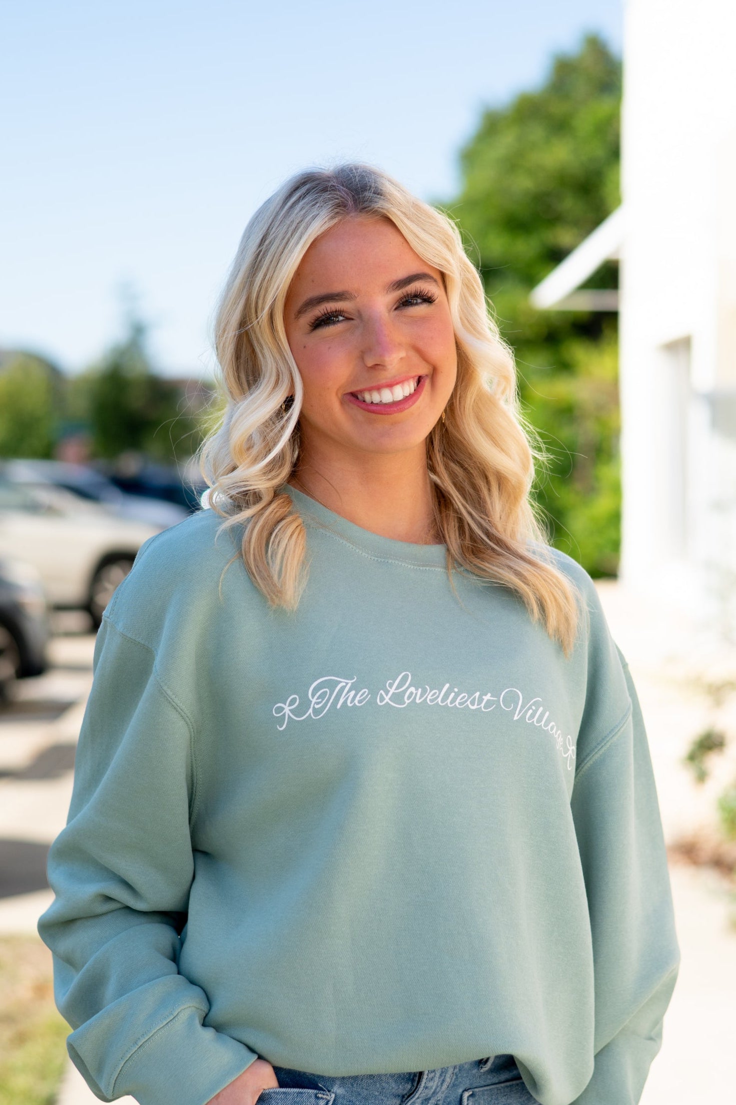 Auburn University Seafoam Crewneck with cursive writing on the front and an open locket with the writing “WDE” inside on the back