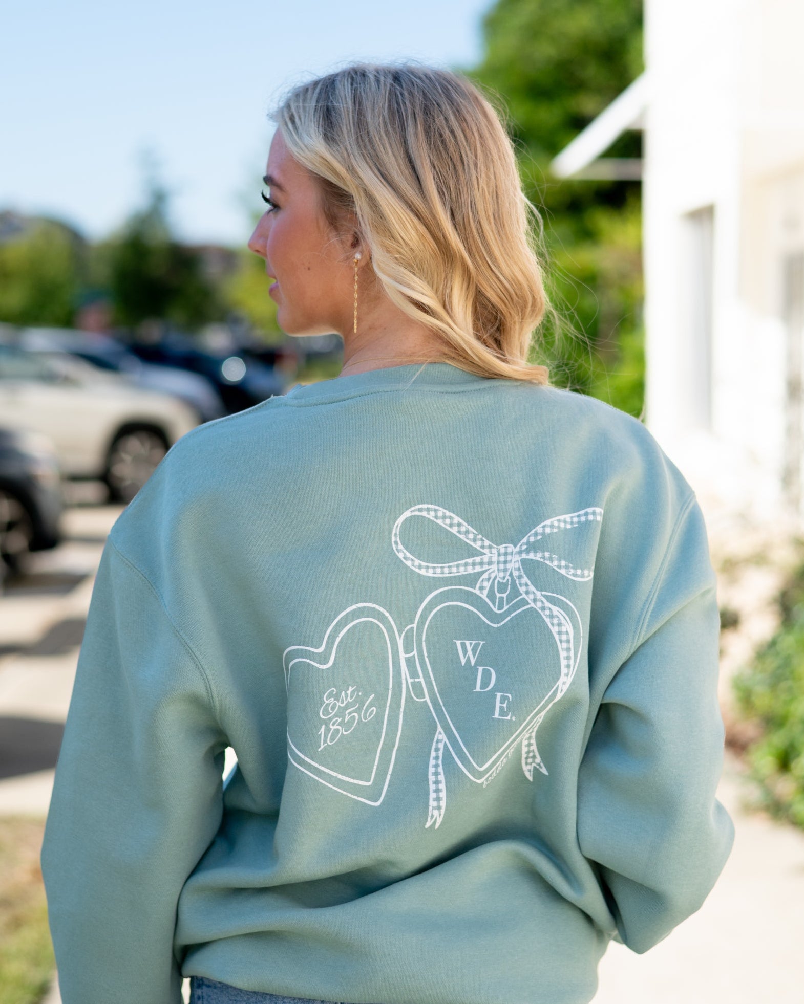 Auburn University Seafoam Crewneck with cursive writing on the front and an open locket with the writing “WDE” inside on the back