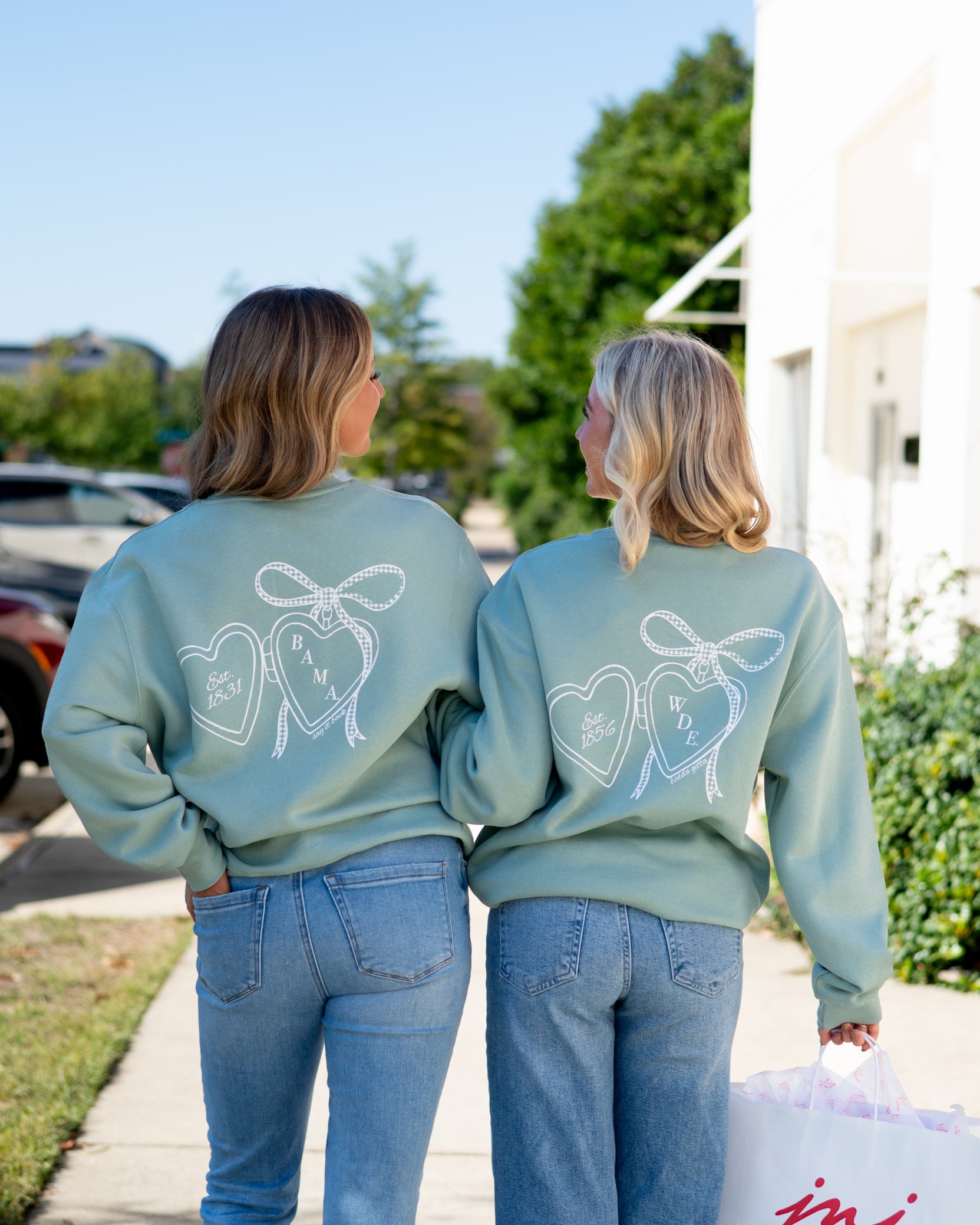 Auburn University Seafoam Crewneck with cursive writing on the front and an open locket with the writing “WDE” inside on the back
