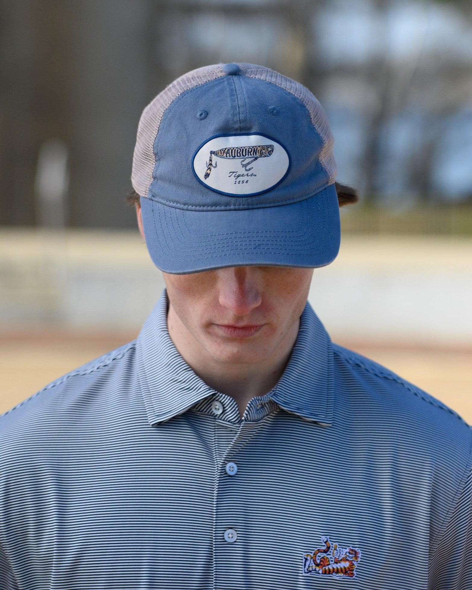 Auburn University Dusty Navy Hat featuring a patch with a tiger fishing lure with the Blue text “Auburn”