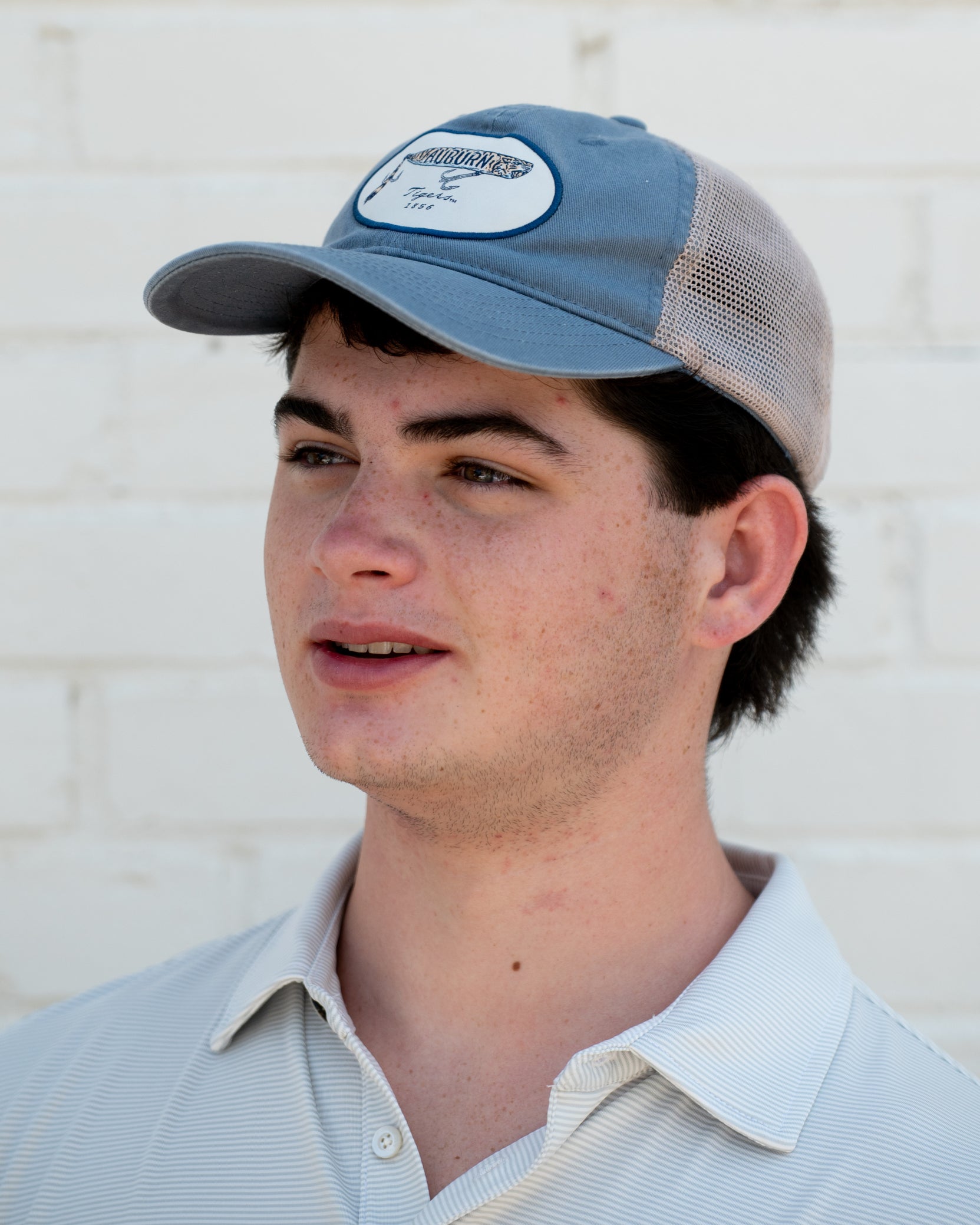 Auburn University Dusty Navy Hat featuring a patch with a tiger fishing lure with the Blue text “Auburn”