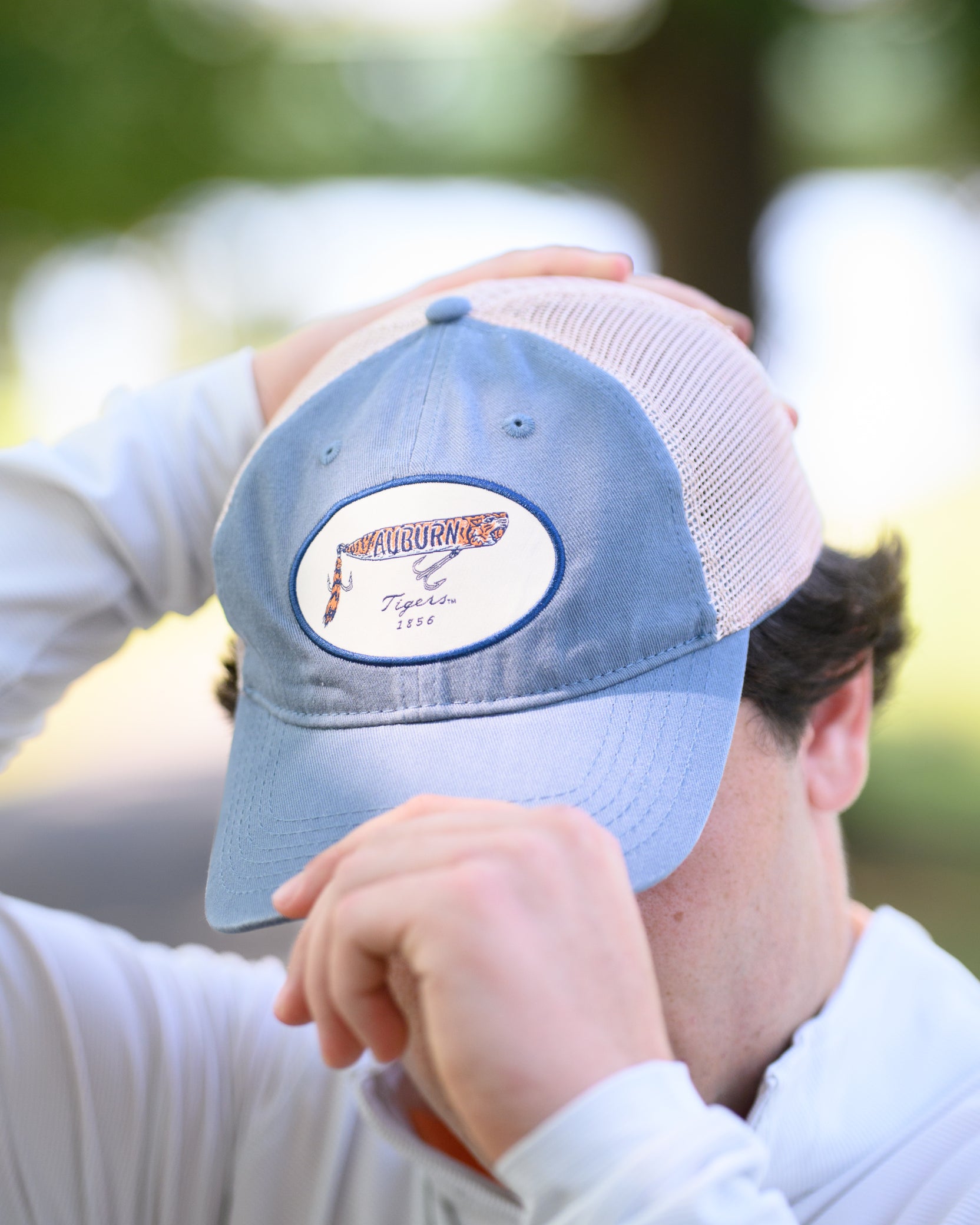 Auburn University Dusty Navy Hat featuring a patch with a tiger fishing lure with the Blue text “Auburn”