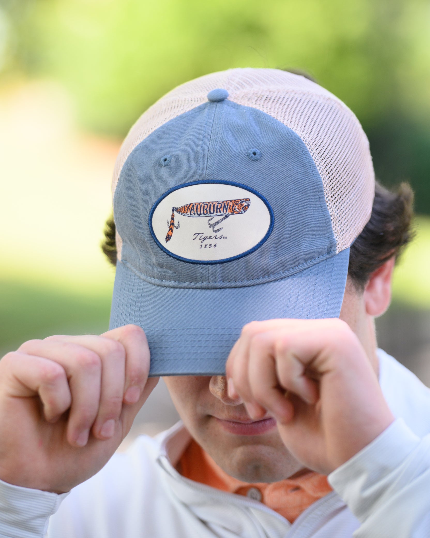 Auburn University Dusty Navy Hat featuring a patch with a tiger fishing lure with the Blue text “Auburn”