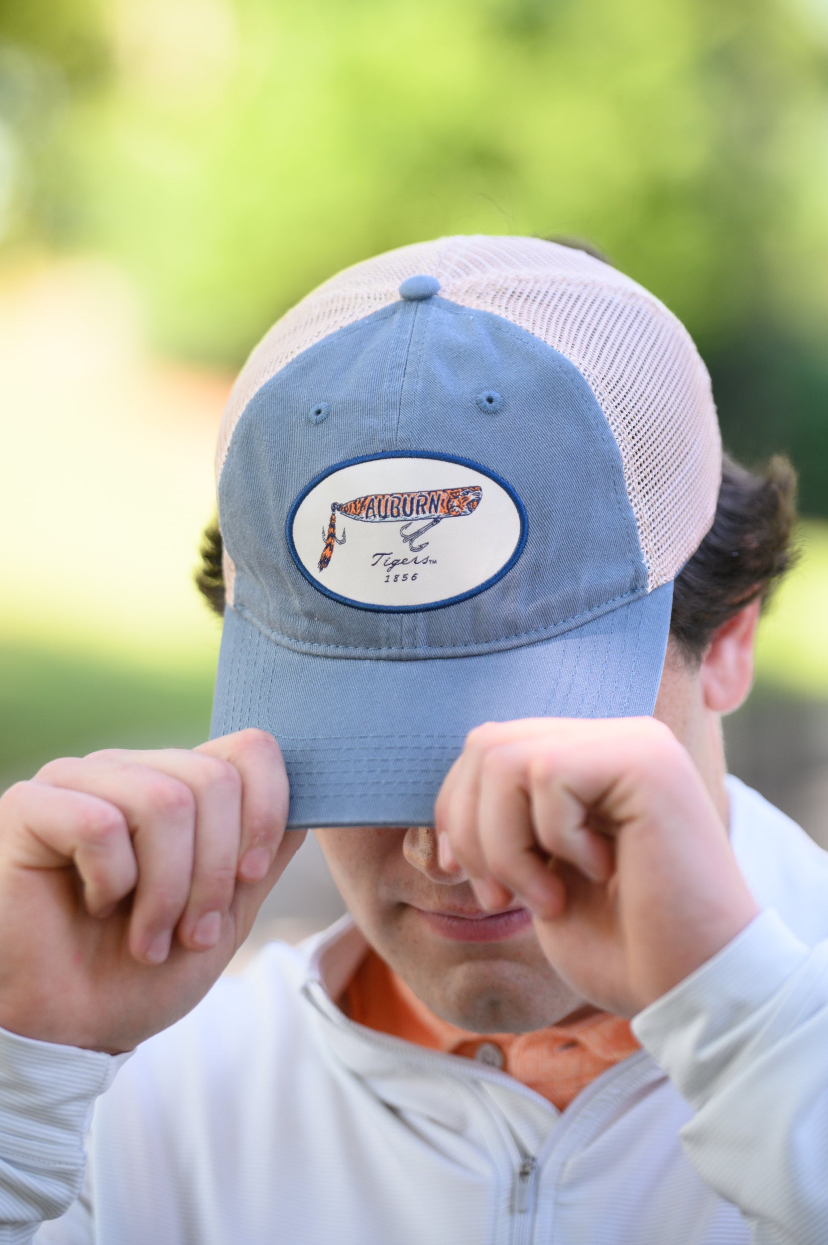 Auburn University Dusty Navy Hat featuring a patch with a tiger fishing lure with the Blue text “Auburn”