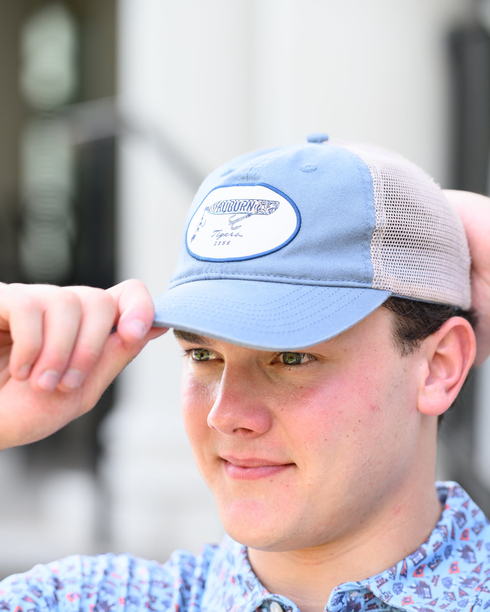 Auburn University Dusty Navy Hat featuring a patch with a tiger fishing lure with the Blue text “Auburn”