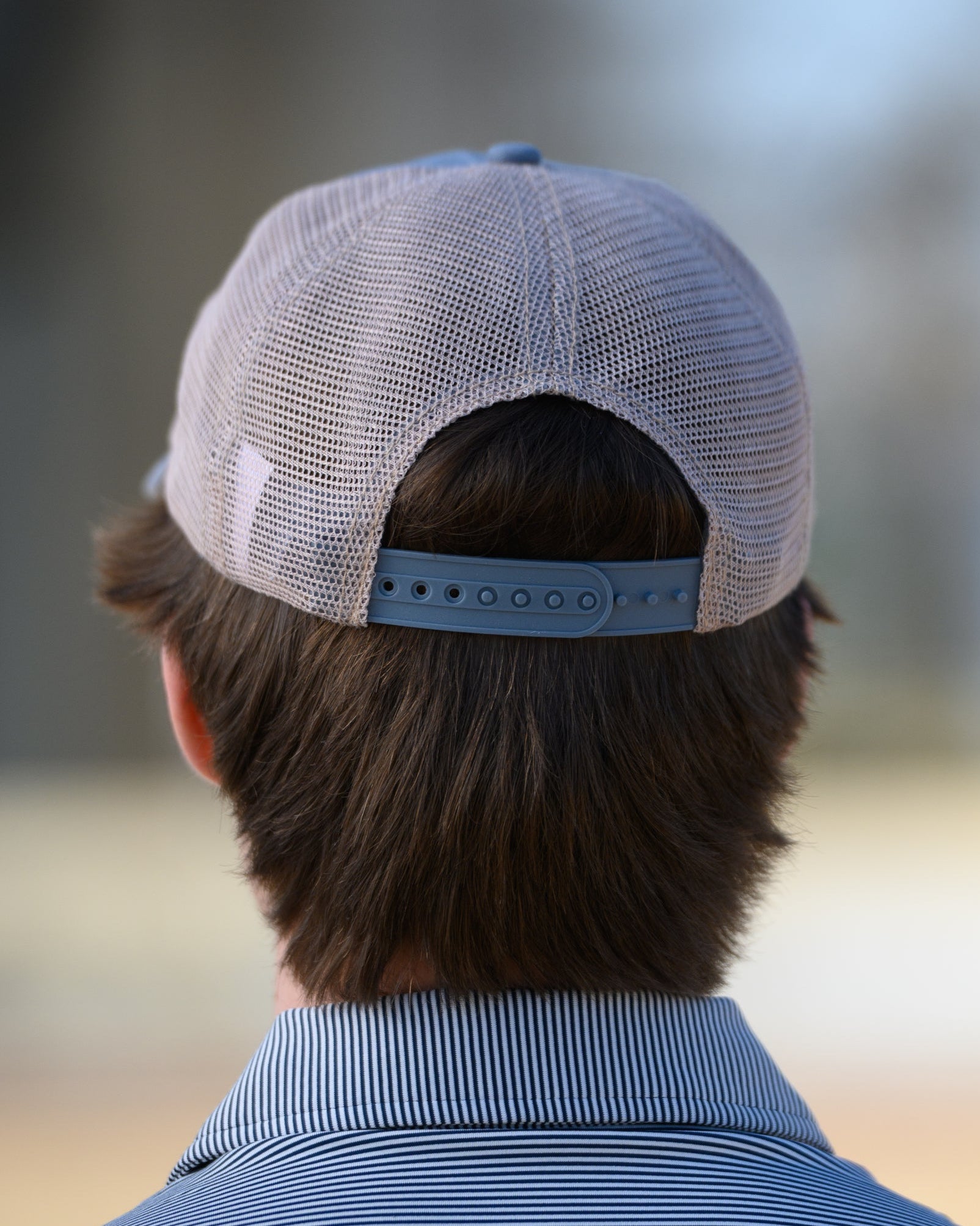 Auburn University Dusty Navy Hat featuring a patch with a tiger fishing lure with the Blue text “Auburn."
Snapback Trucker