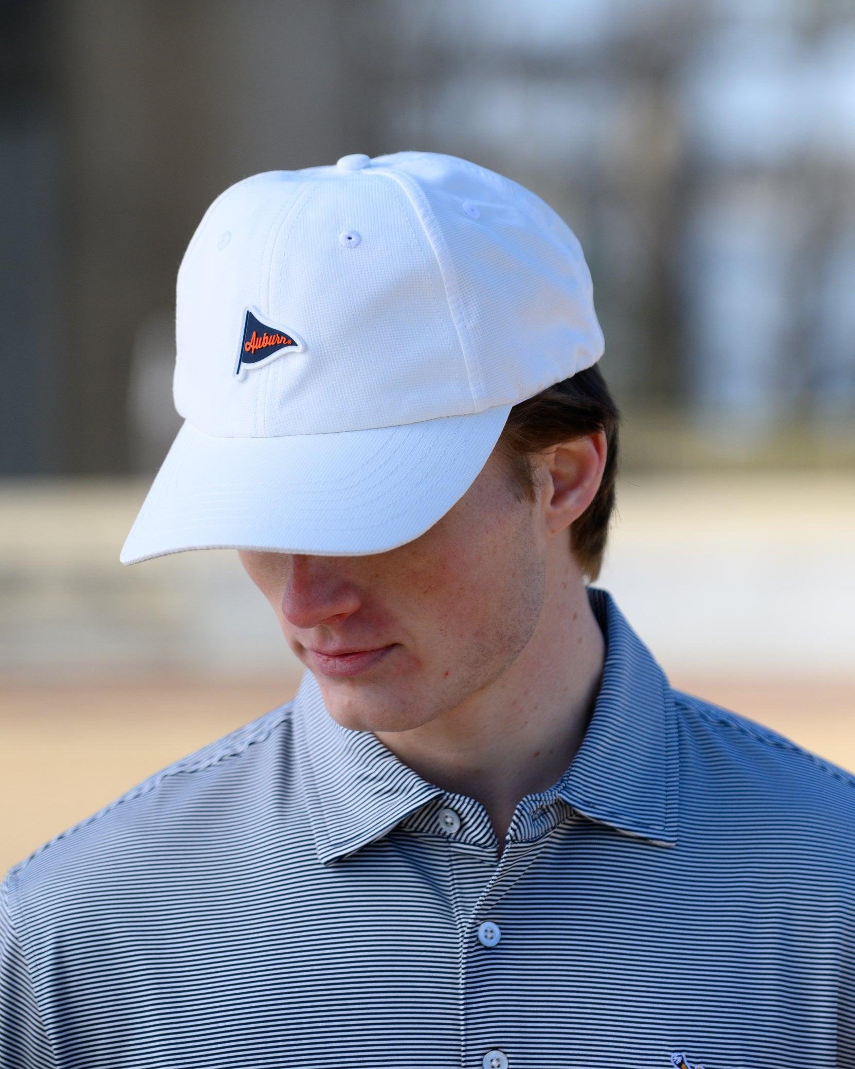 Auburn University White Hat featuring a Navy pennant flag patch with Orange script “Auburn”