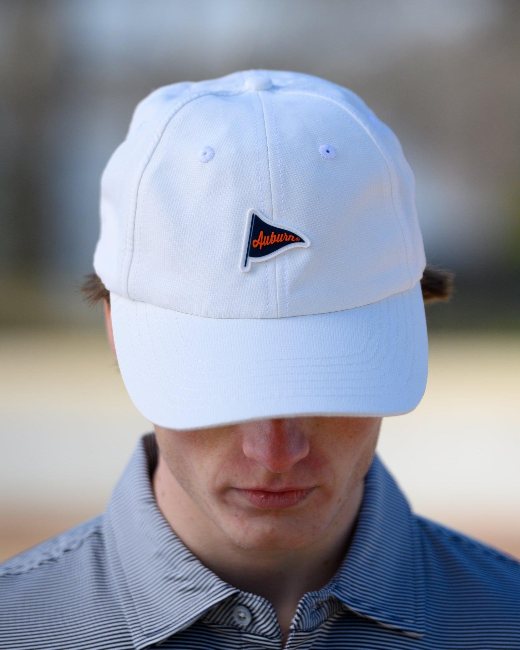 Auburn University White Hat featuring a Navy pennant flag patch with Orange script “Auburn”