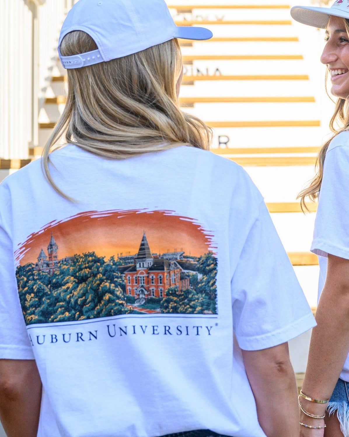 Auburn University Auburn Skyline White Comfort Colors T-Shirt with an image of a sun setting on the University above text "Auburn University"