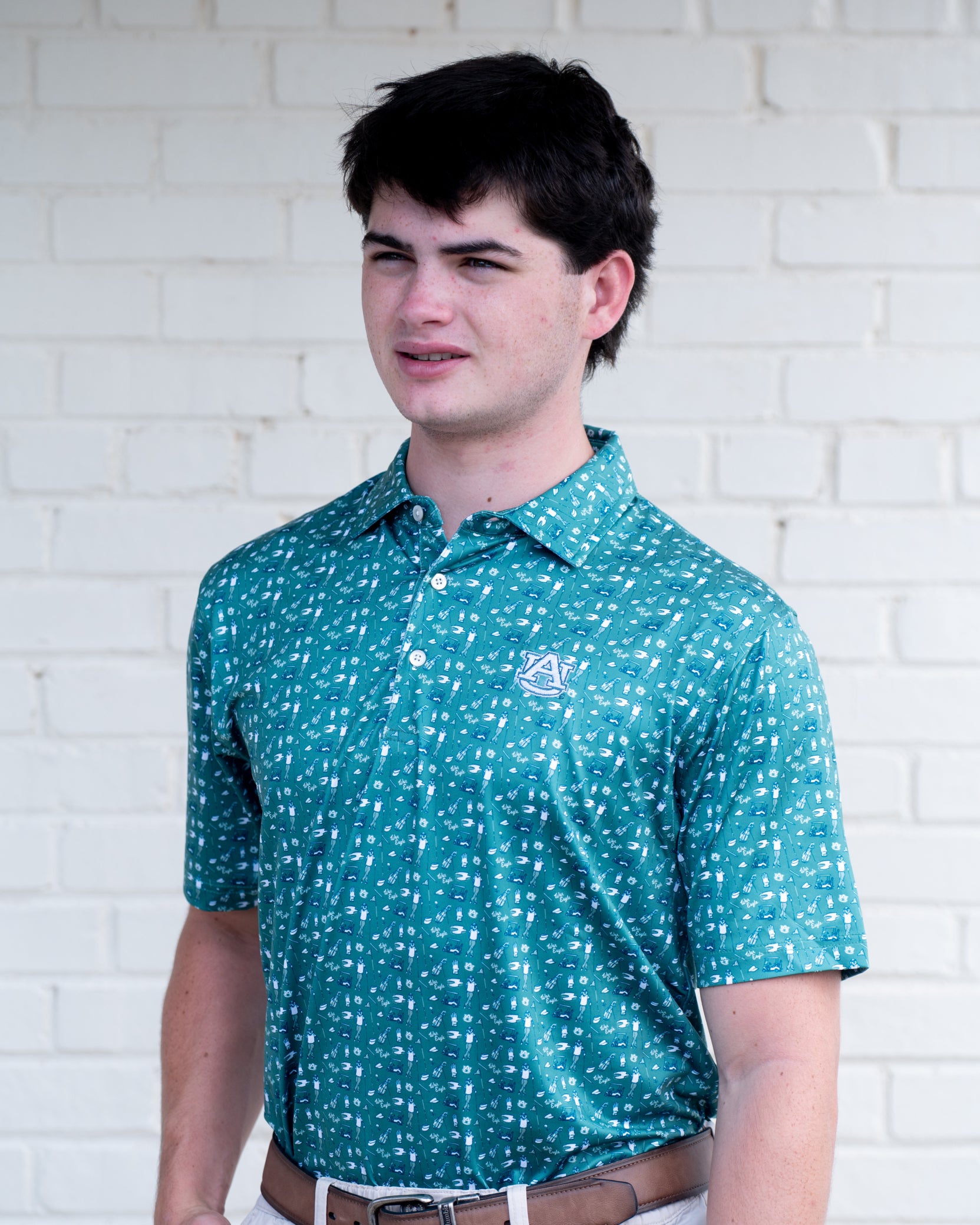 Auburn University Green Men’s Polo with an Auburn golf-themed pattern and Silver AU Logo embroidery