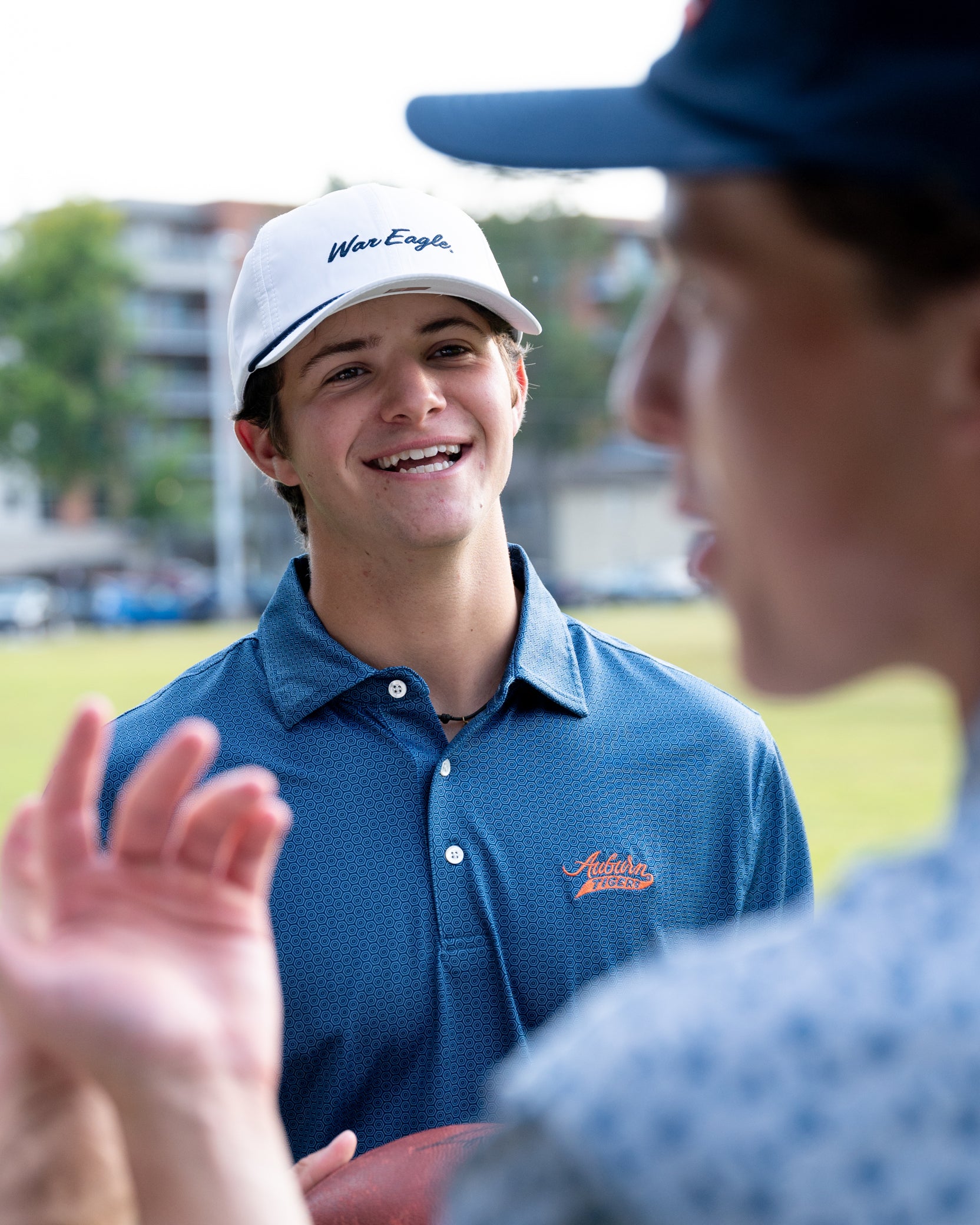 Auburn University Auburn Tigers Navy Hex Polo Men's Navy JNJ Performance polo with a subtle hex pattern and an embroidered Auburn Tigers script logo on the left chest.