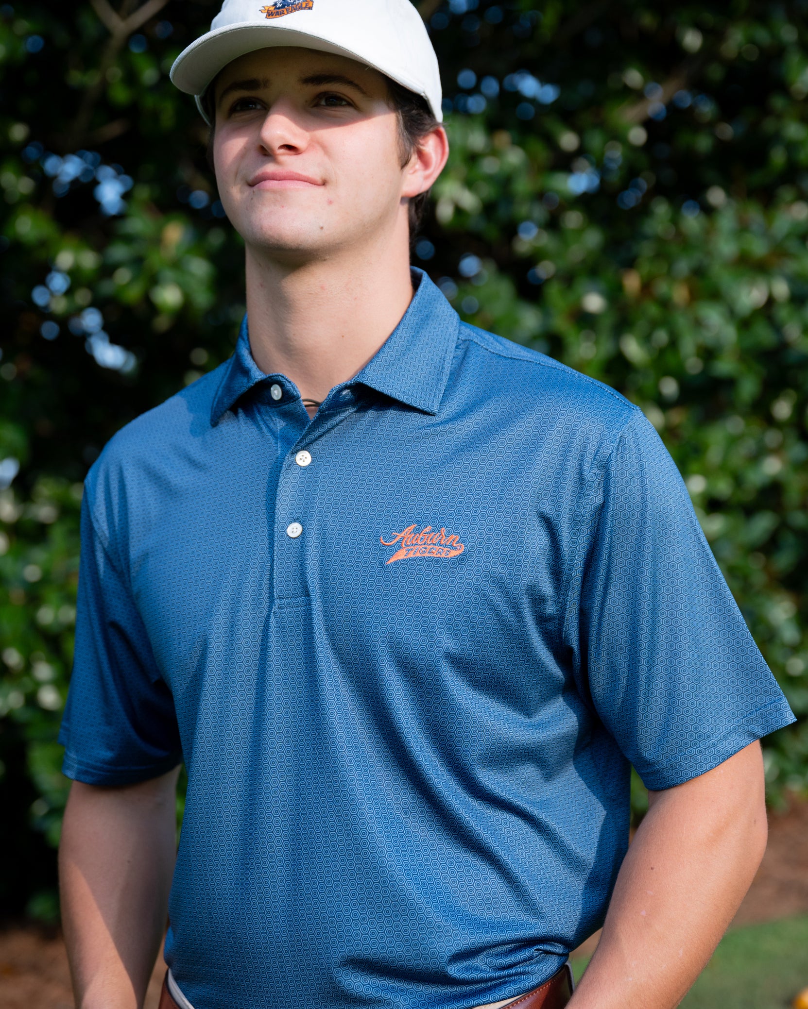 Auburn University Auburn Tigers Navy Hex Polo Men's Navy JNJ Performance polo with a subtle hex pattern and an embroidered Auburn Tigers script logo on the left chest.
