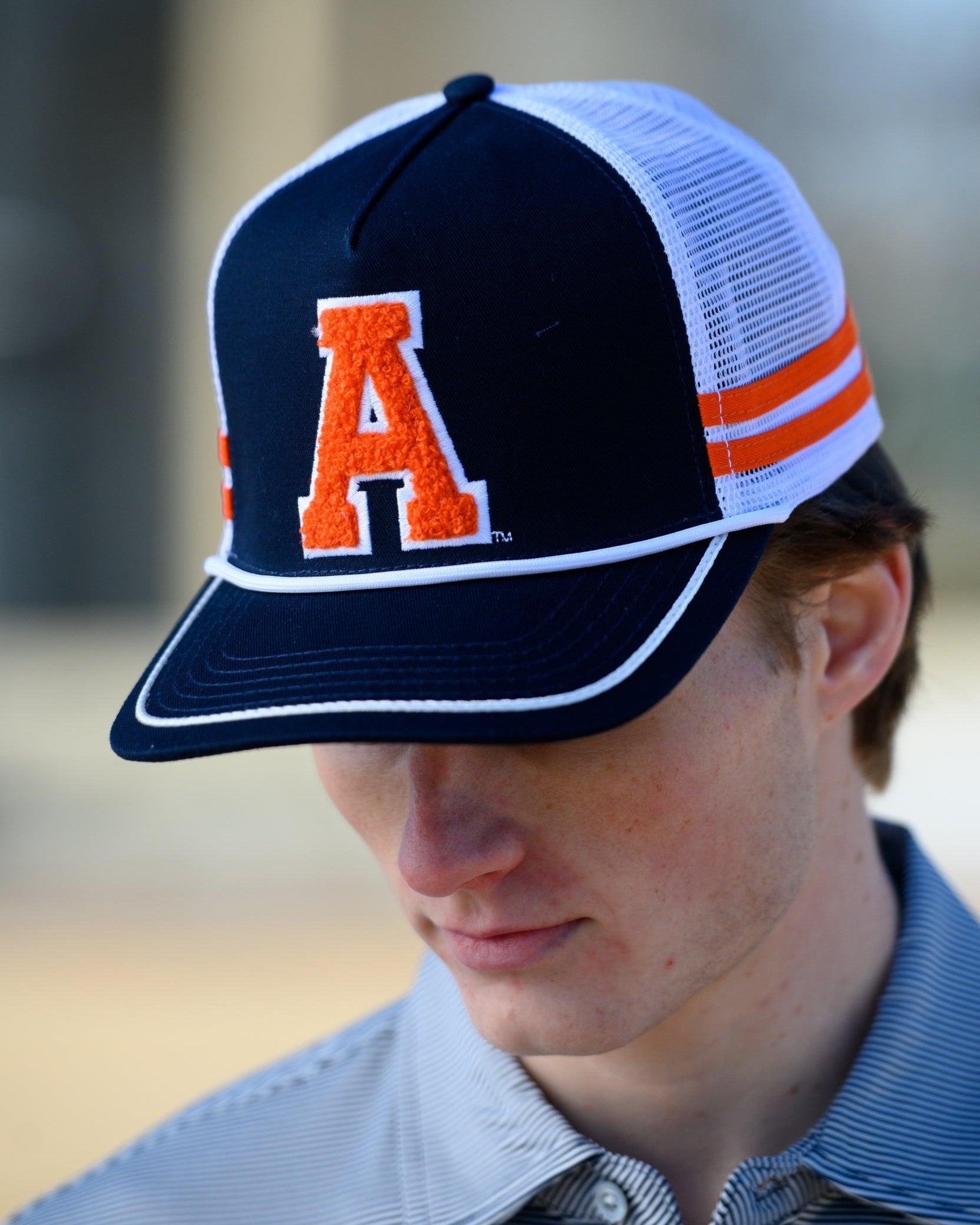 Auburn University Navy and White Trucker hat with Orange stripes and a felt Orange Block A patch.