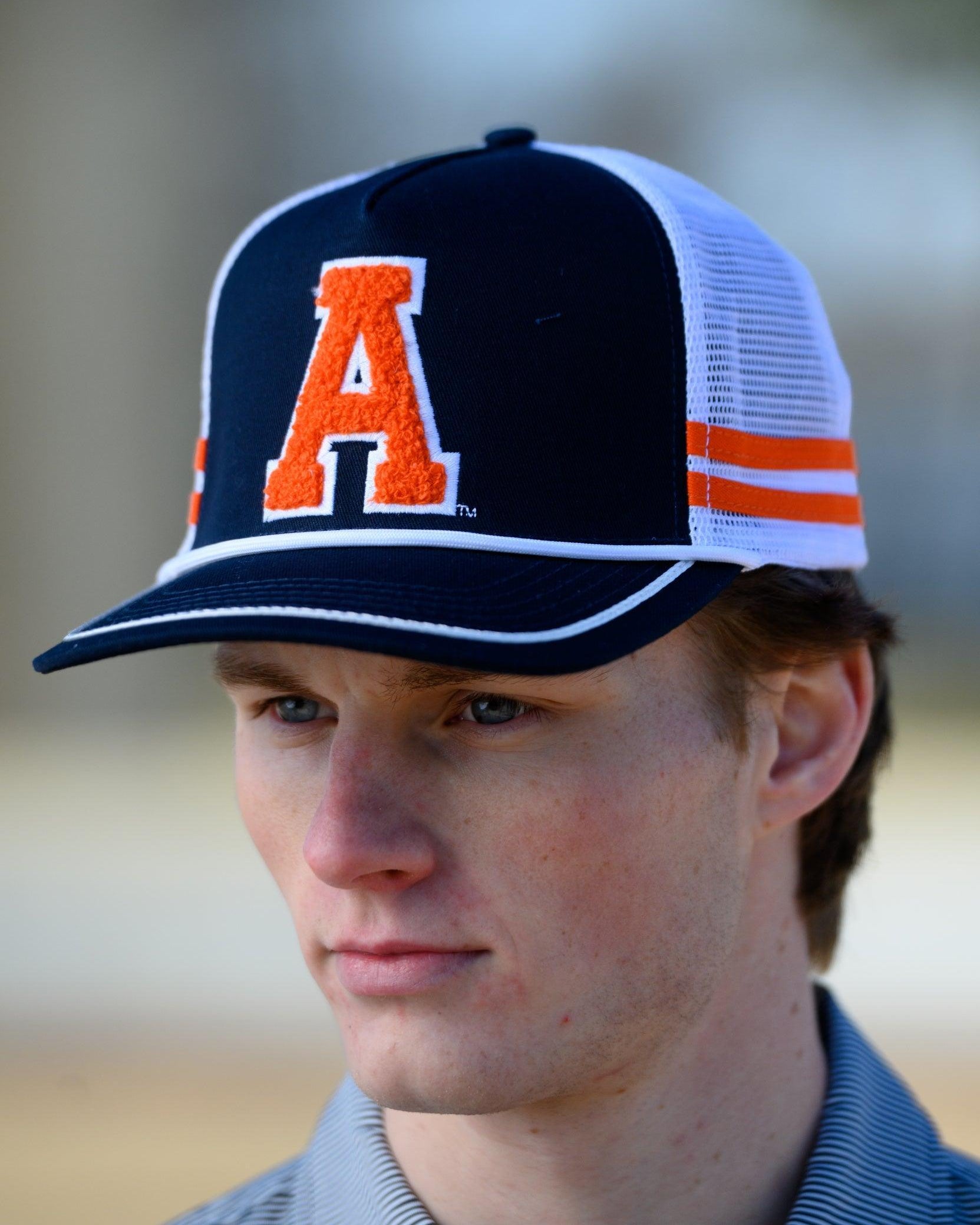 Auburn University Navy and White Trucker hat with Orange stripes and a felt Orange Block A patch.