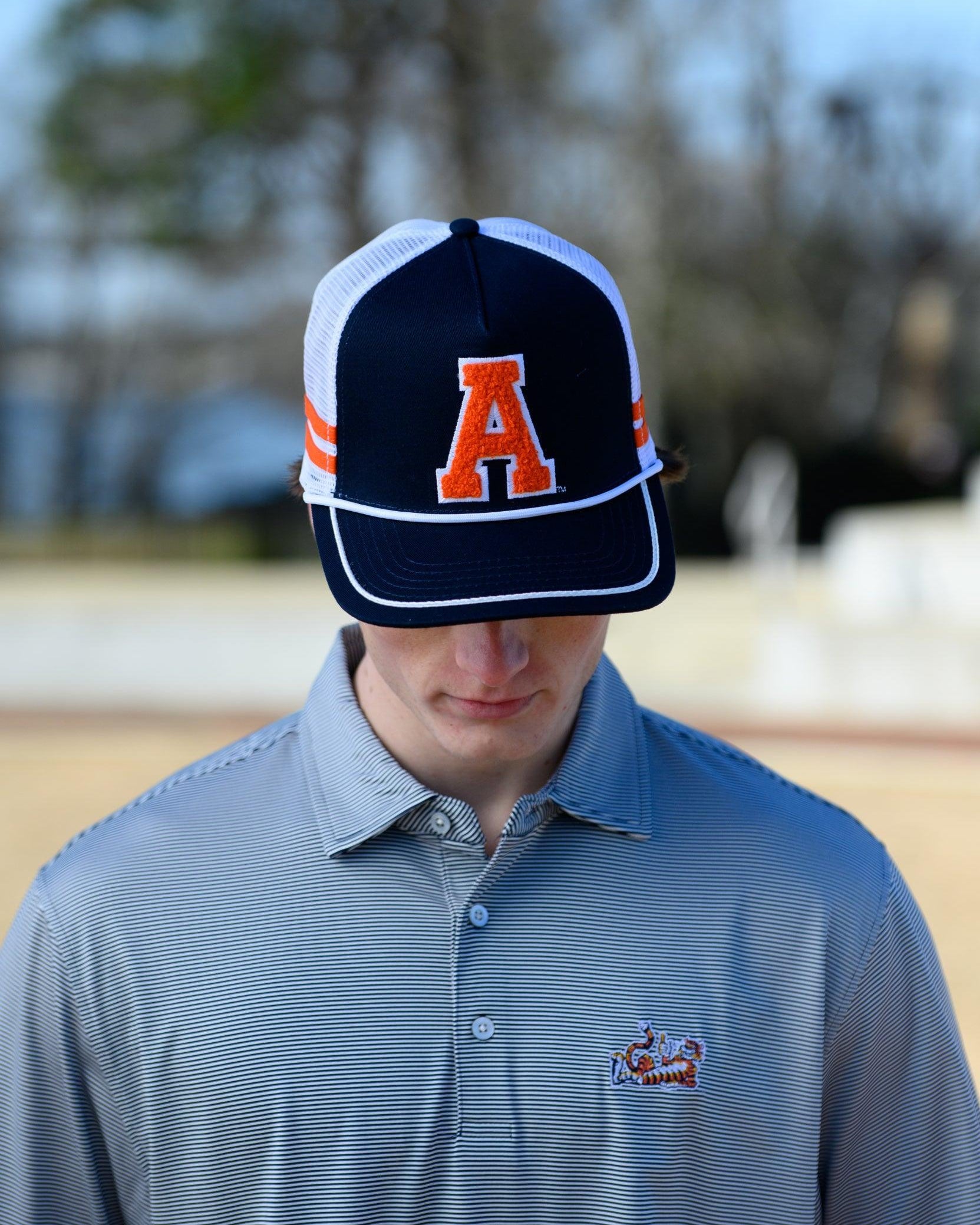 Auburn University Navy and White Trucker hat with Orange stripes and a felt Orange Block A patch.