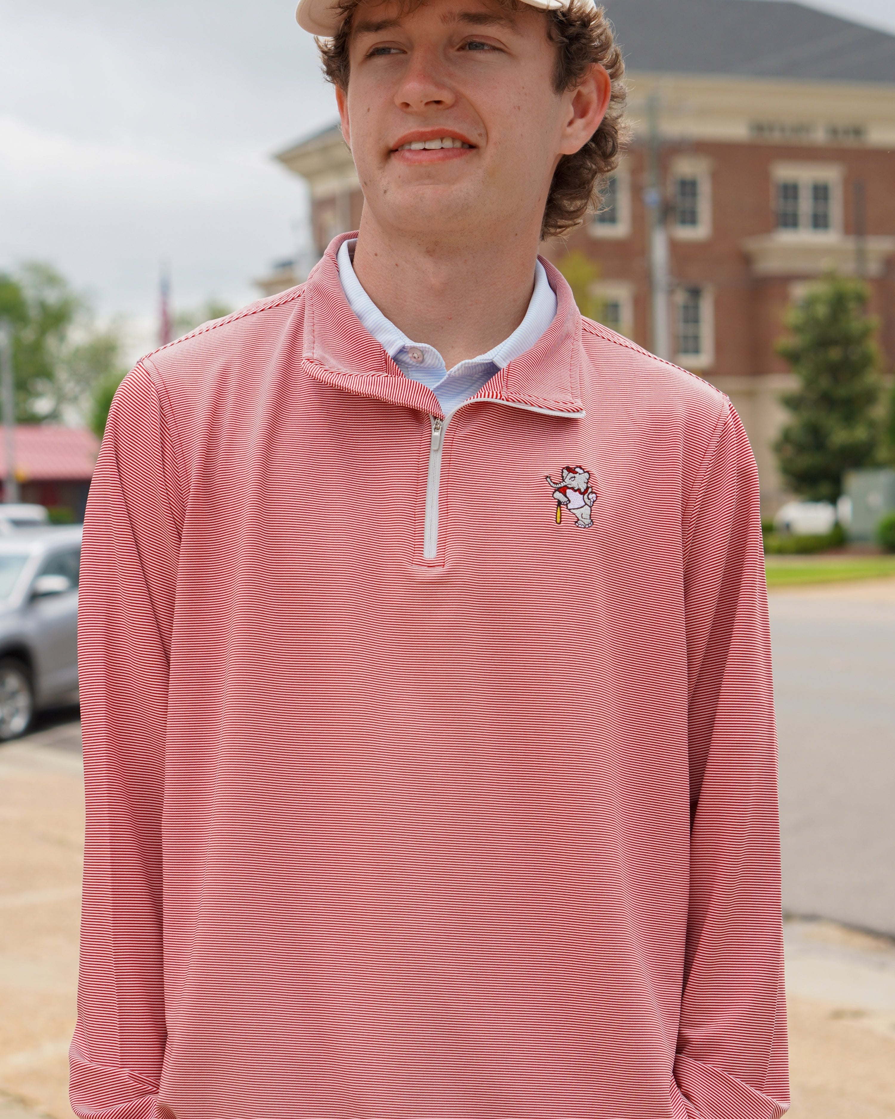 University of Alabama BallPlayer Al Men's Crimson Performance Pullover with an embroidered image of Big Al in a baseball uniform leaning on a baseball bat