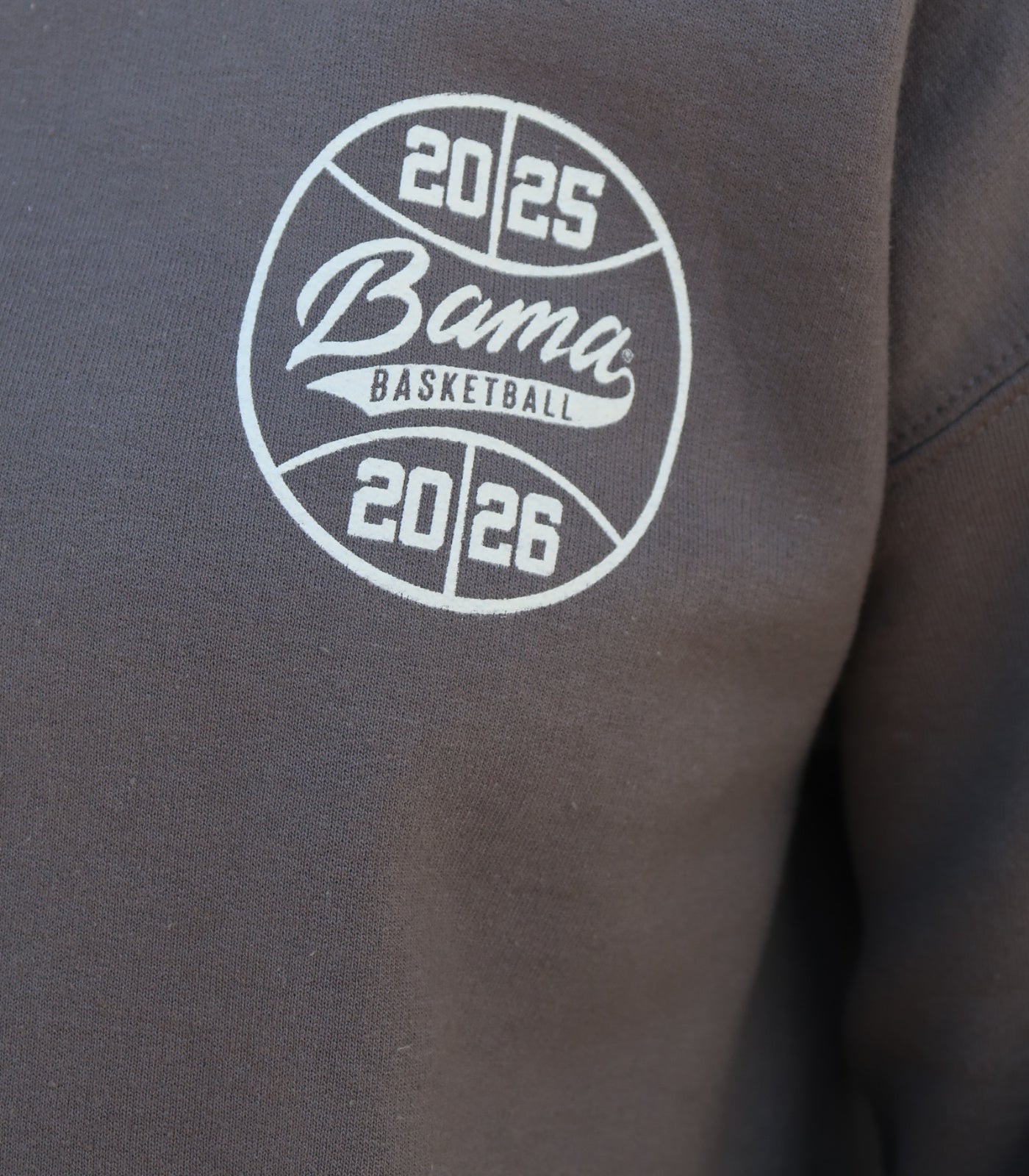 University of Alabama Dark Grey Sweatshirt with an illustration of Big Al dunking a basketball next to text “Big Al” and “the Plaid Palace” above the 2025 Basketball Schedule