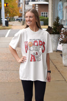 University of Alabama Off-White T-Shirt with Text "Hoops" with a basketball replacing the first "O" above Big Al leaning on a Block A