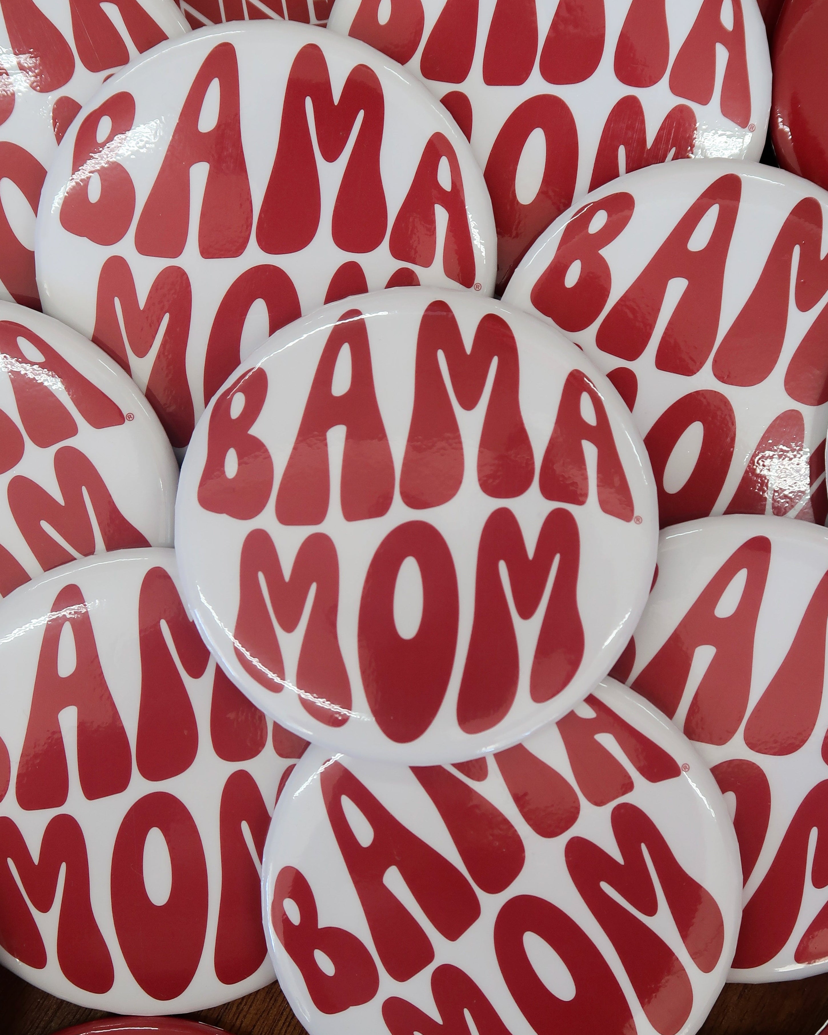 University of Alabama White Button with Red bubble letters that spell “Bama Mom”