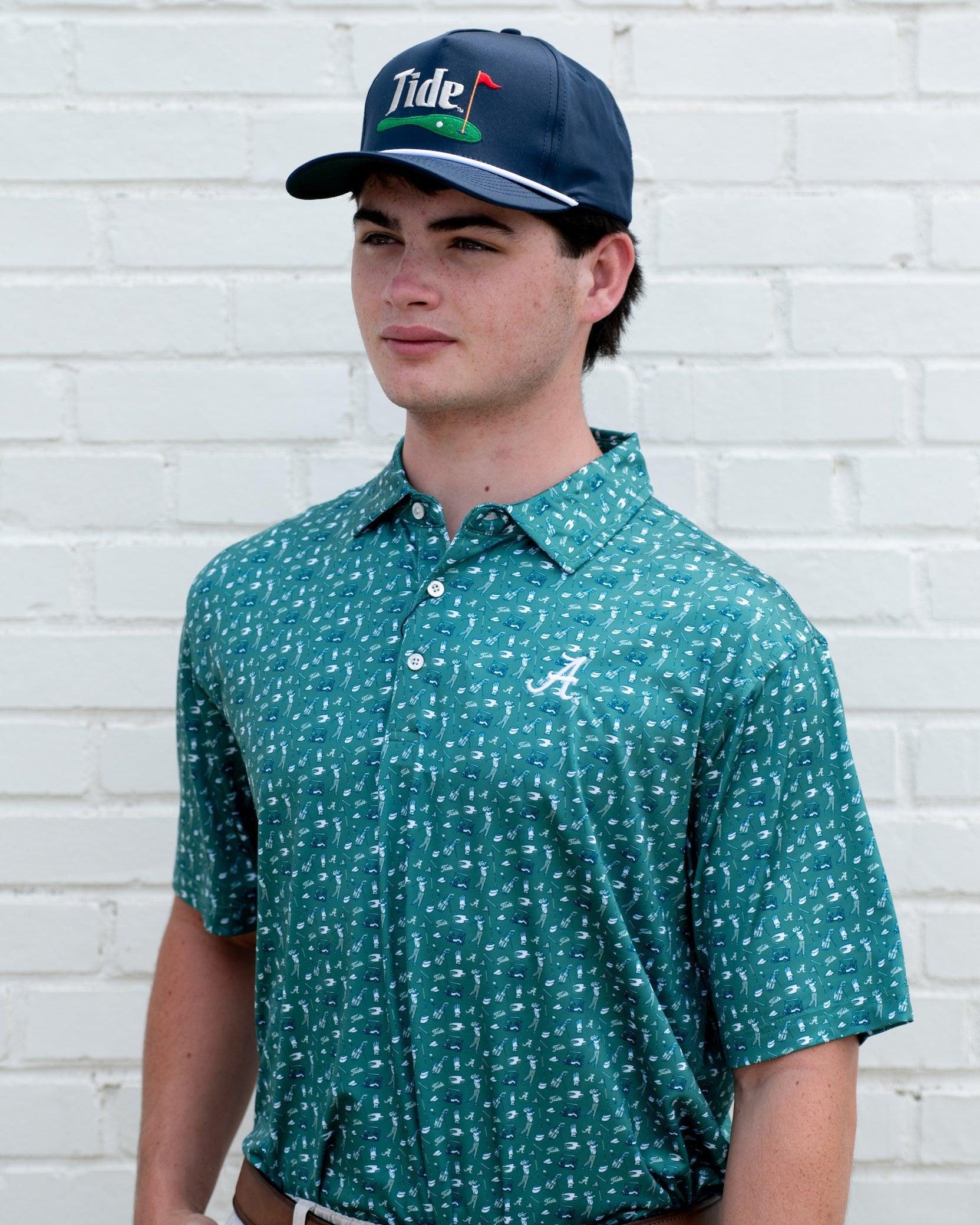 University of Alabama Green Men’s Polo with an Alabama golf-themed pattern and Silver Script A Logo embroidery