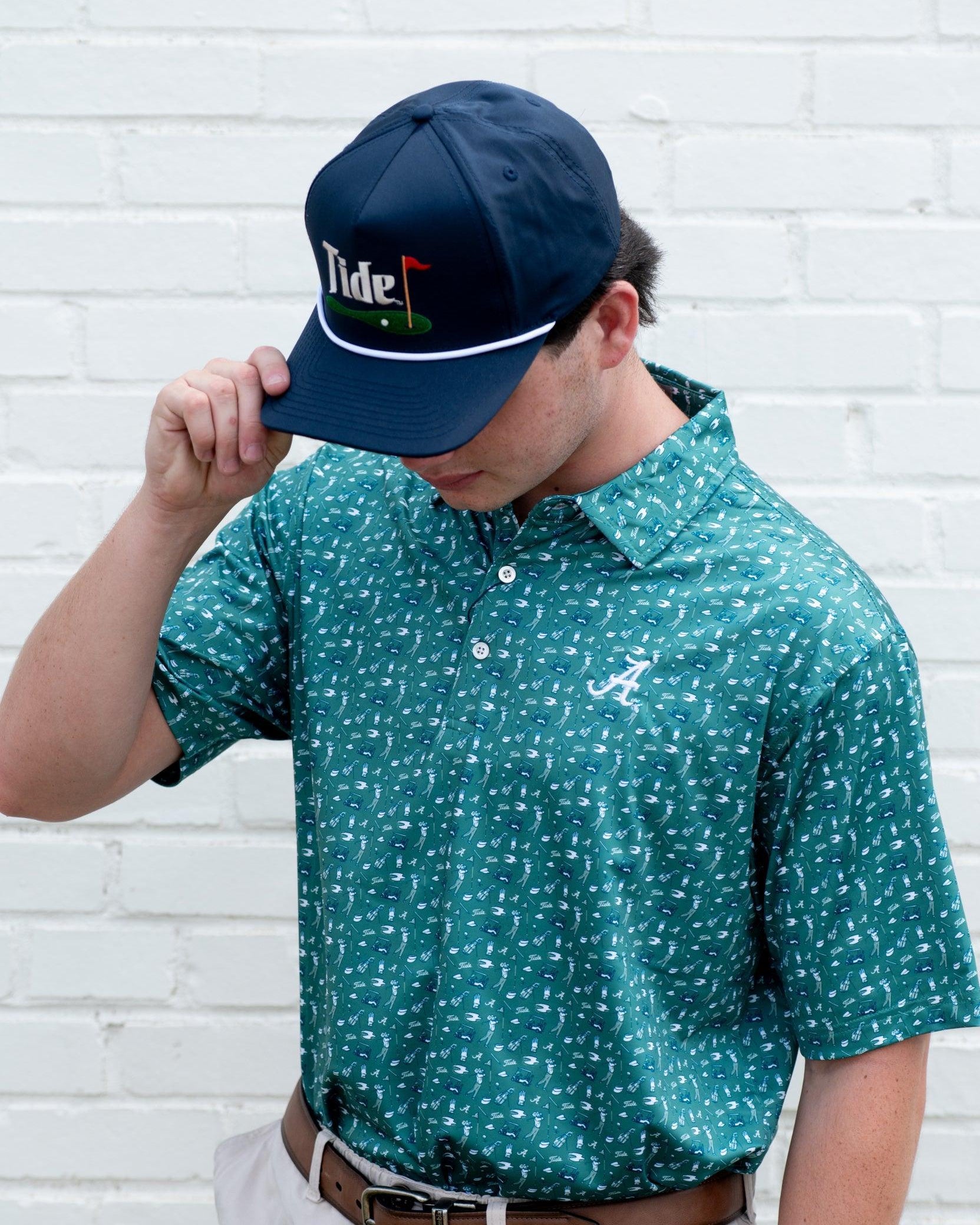 University of Alabama Green Men’s Polo with an Alabama golf-themed pattern and Silver Script A Logo embroidery