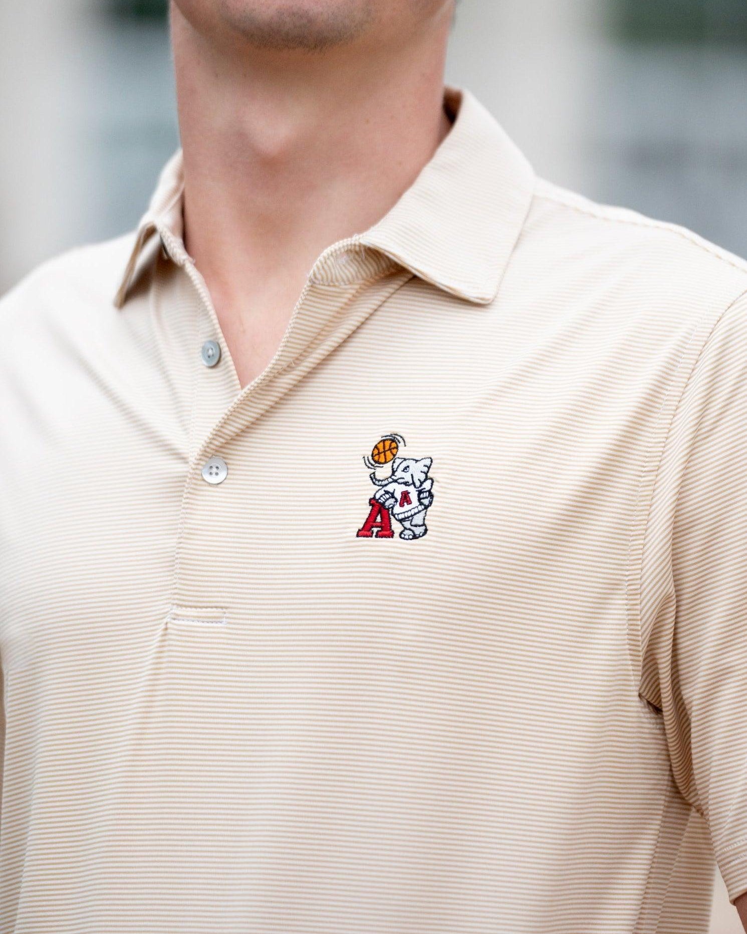 University of Alabama Basketball Al Tan Men’s Polo with an embroidered Big Al in a sweater holding a basketball and leaning against an "A"