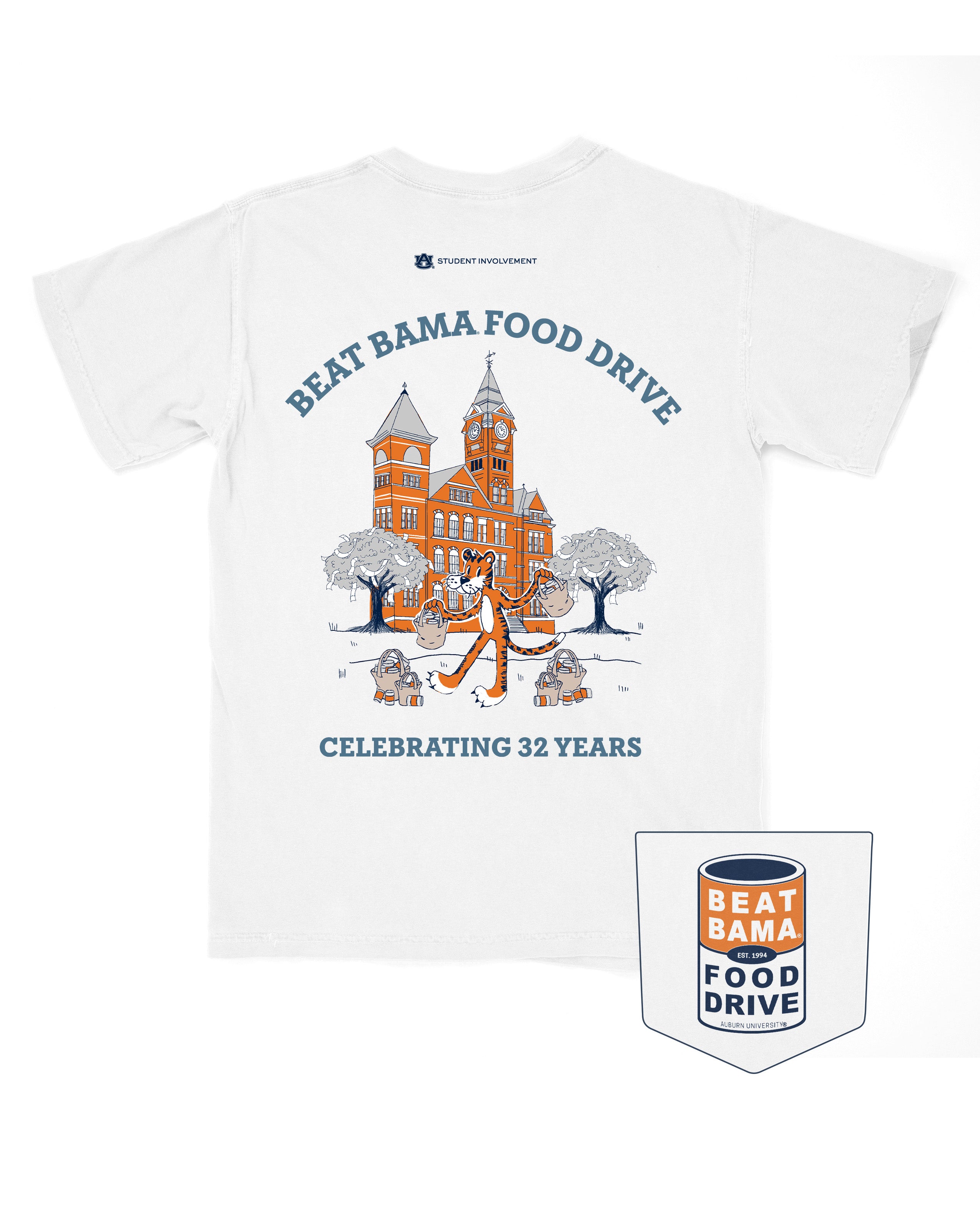 Auburn University White T-Shirt with Aubie collecting cans around Stamford Hall with Blue Text “Beat Bama Food Drive Celebrating 32 Years”