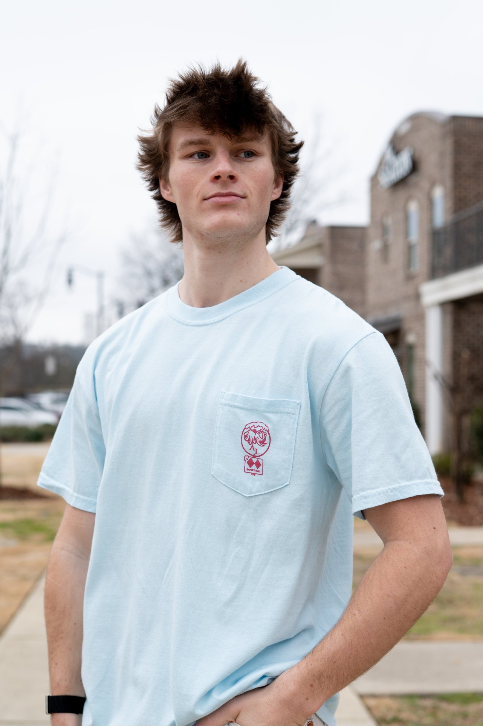 University of Alabama Light Blue T-Shirt with a snow-covered Elephant Seal on the front pocket