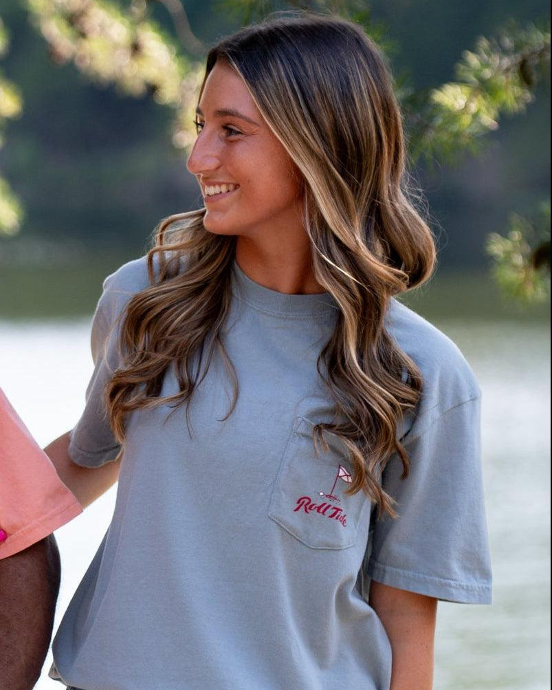 University of Alabama Big Al Golf Cart Grey Comfort Colors -Shirt with the text "Roll Tide" above an image of Big Al wearing sunglasses and driving a golf cart