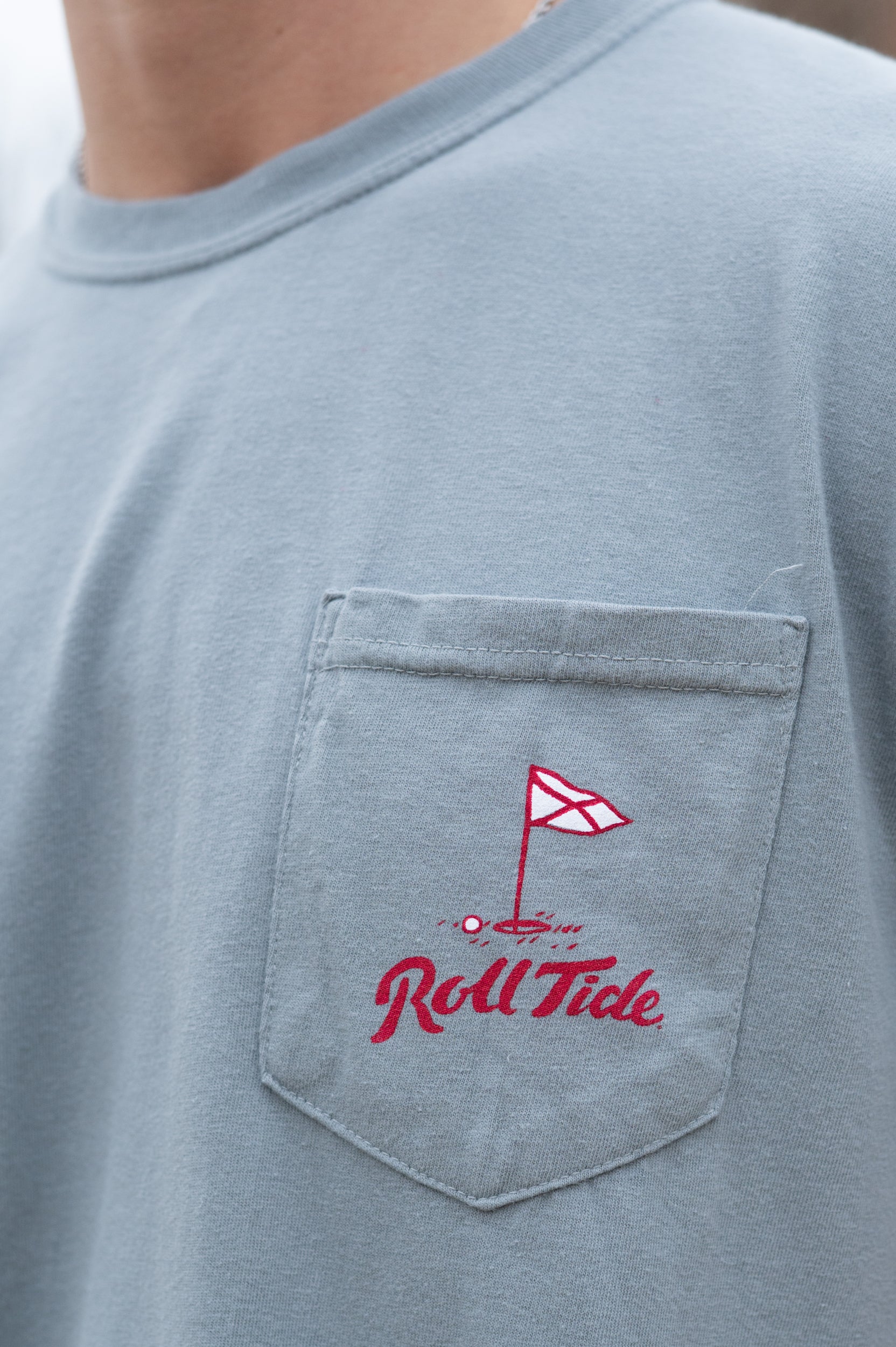 University of Alabama Grey Shirt with a Golf Flag over “Roll Tide” Script on the Front Pocket