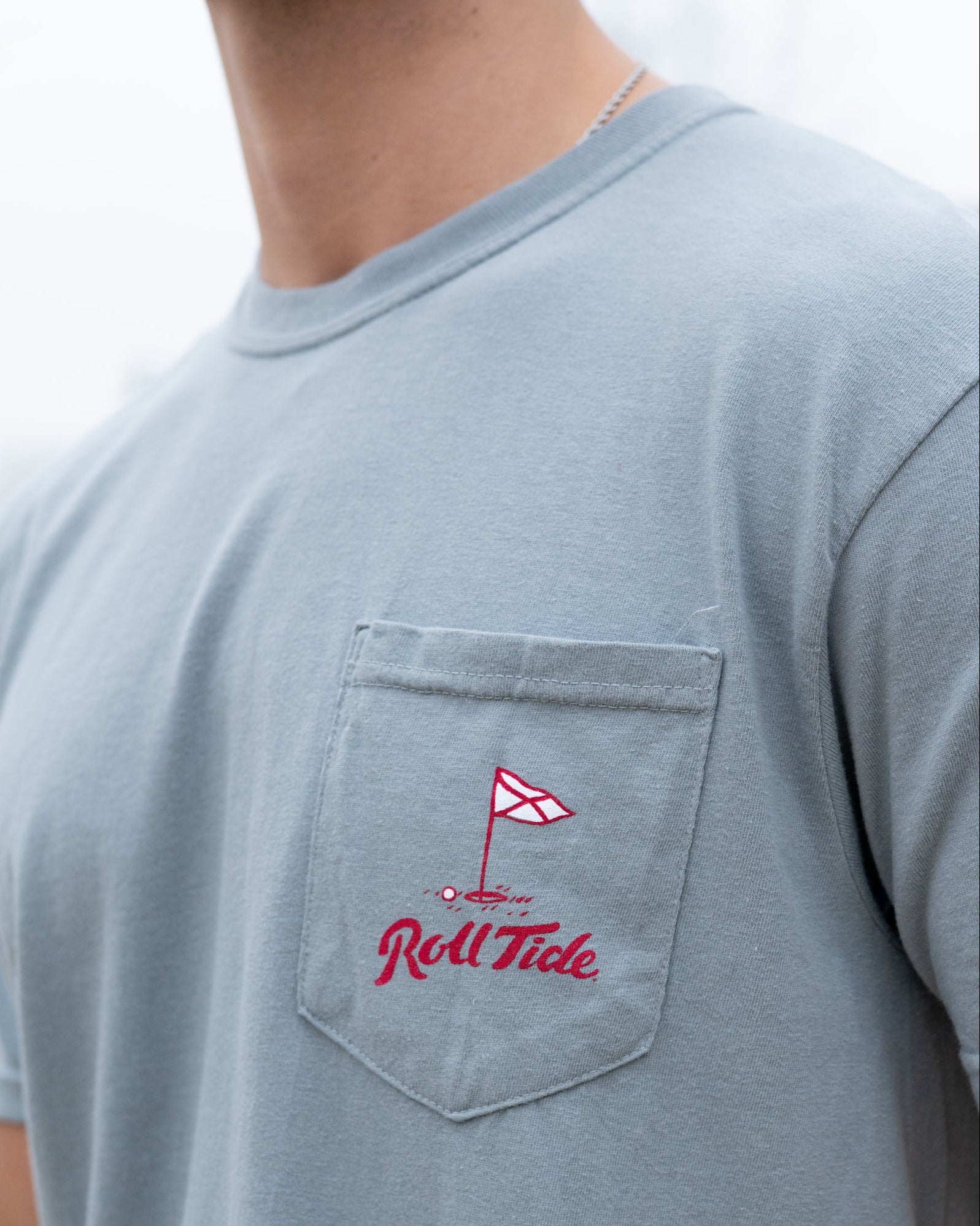 University of Alabama Grey Shirt with a Golf Flag over “Roll Tide” Script on the Front Pocket