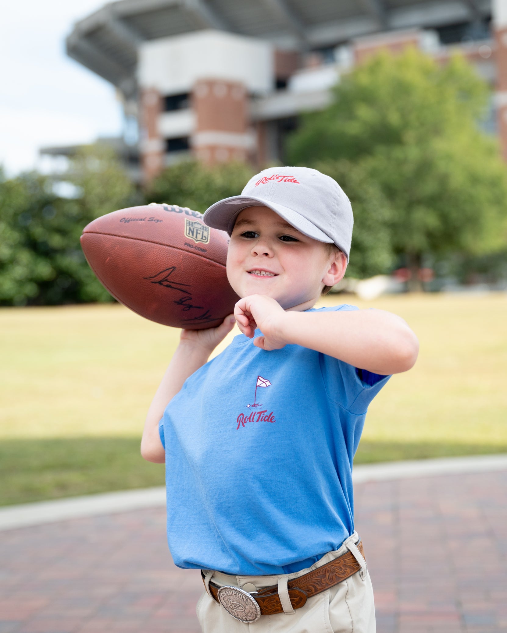 University of Alabama Big Al Golf Cart Blue SoftShirts Youth Tee with the text "Roll Tide" above an image of Big Al wearing sunglasses and driving a golf cart