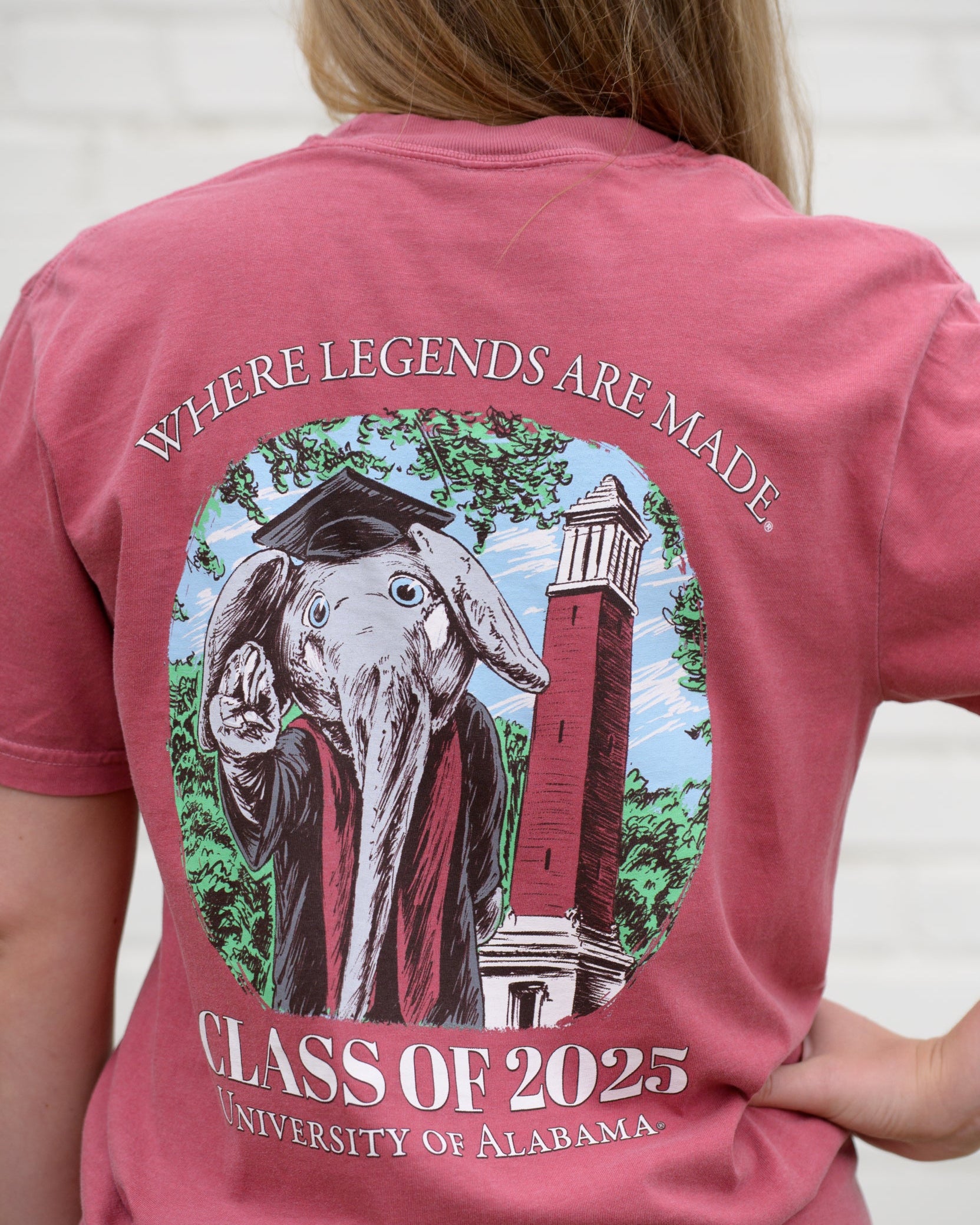 University of Alabama Red Big Al Graduation T-Shirt with an image of Big Al in graduation attire in front of Denny Chimes above White text "Class of 2025"