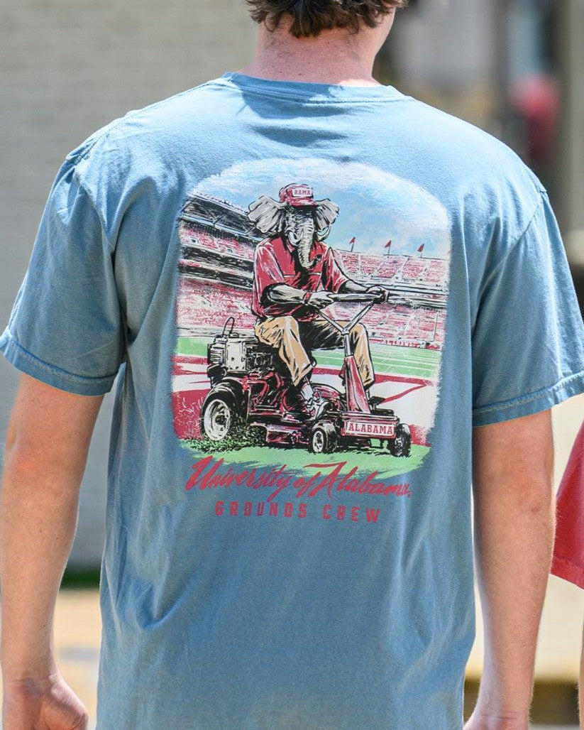 University of Alabama Blue Big Al Grounds Crew T-Shirt with an image of Big Al in a polo and khakis riding a lawnmower
