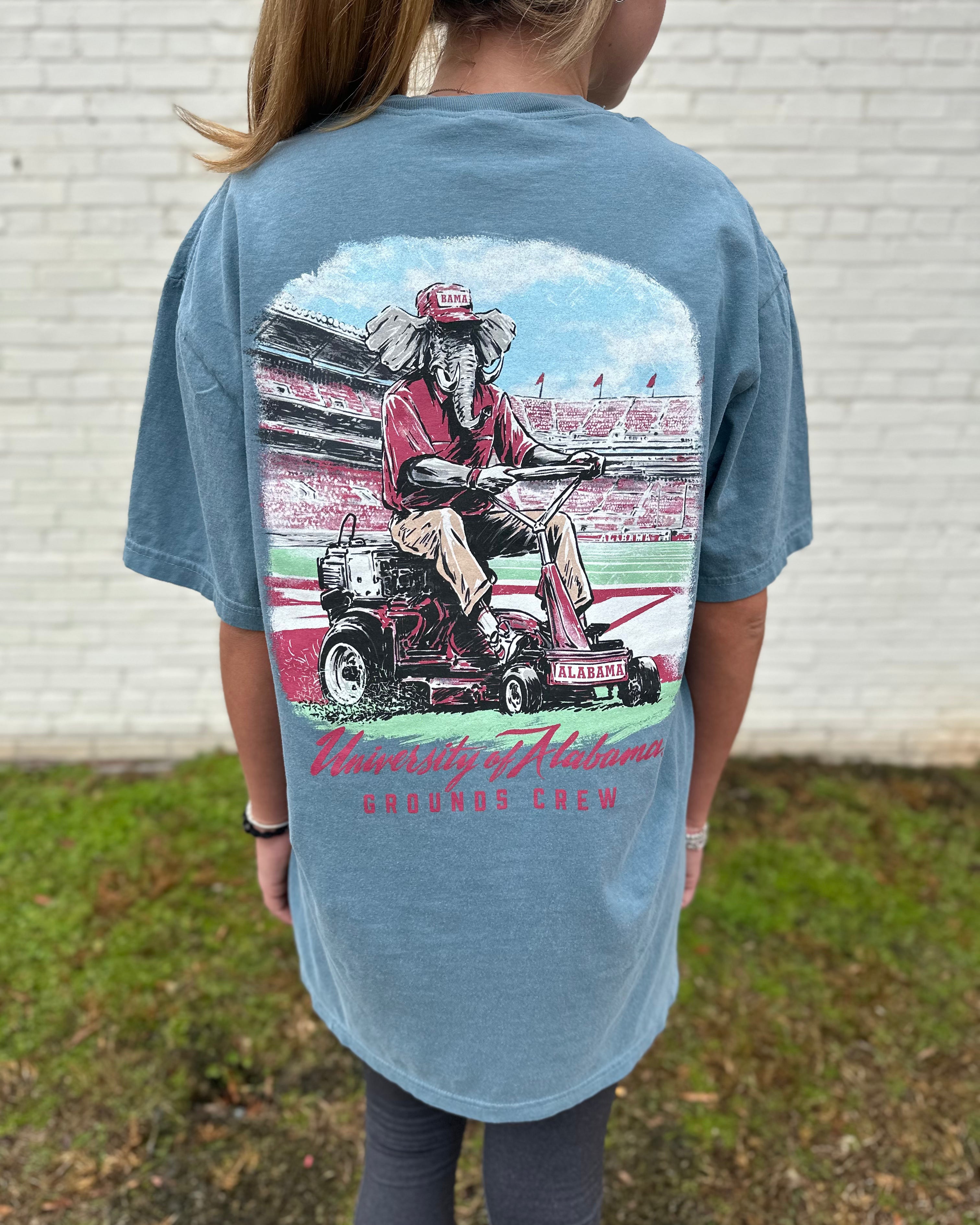 University of Alabama Blue Big Al Grounds Crew T-Shirt with an image of Big Al in a polo and khakis riding a lawnmower