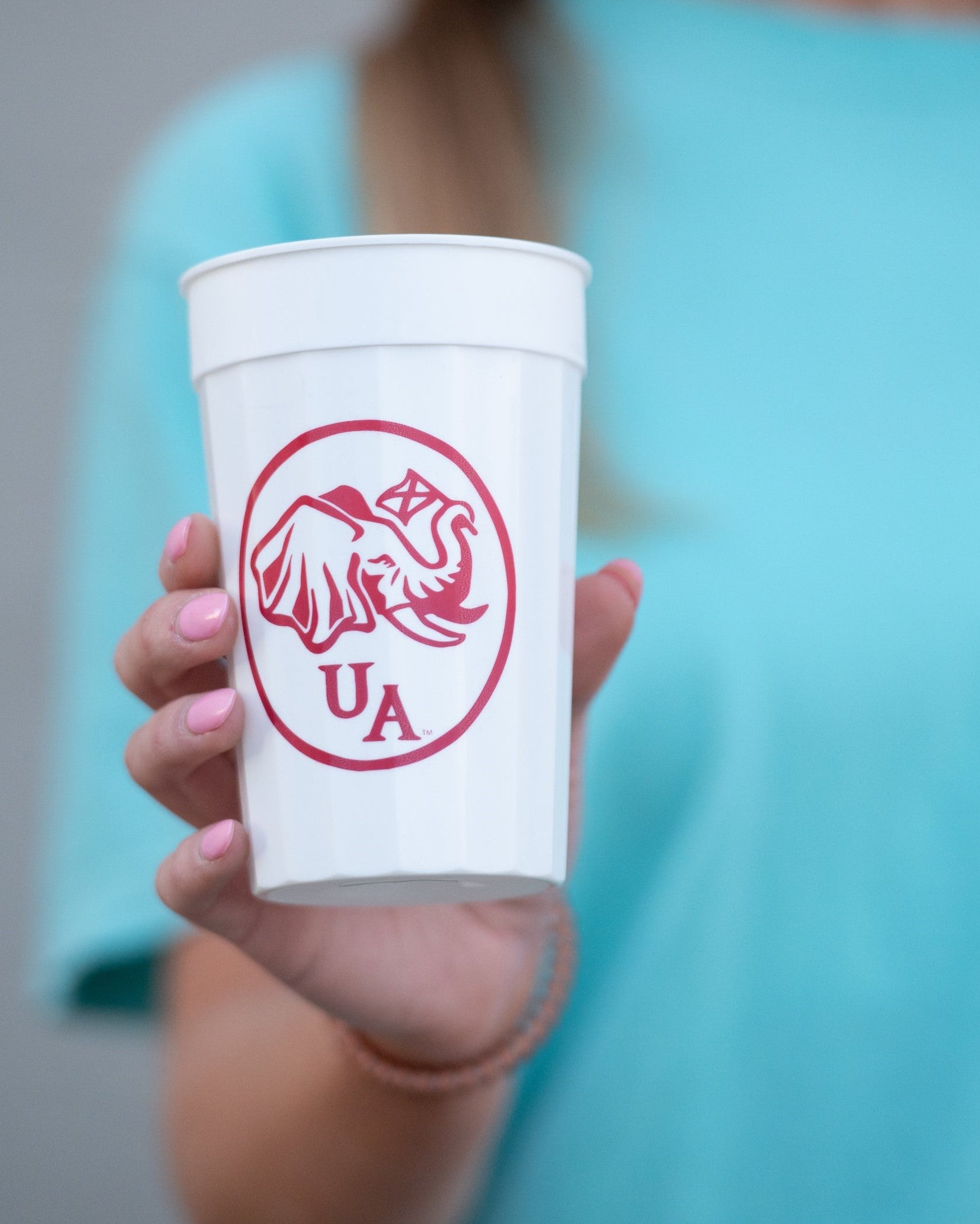 University of Alabama White Stadium Cup with an image of an elephant holding an Alabama State flag above the letters "UA"
