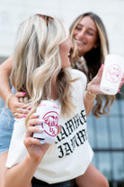 University of Alabama White Neoprene Koozie with an image of an elephant holding an Alabama State flag above the letters "UA"