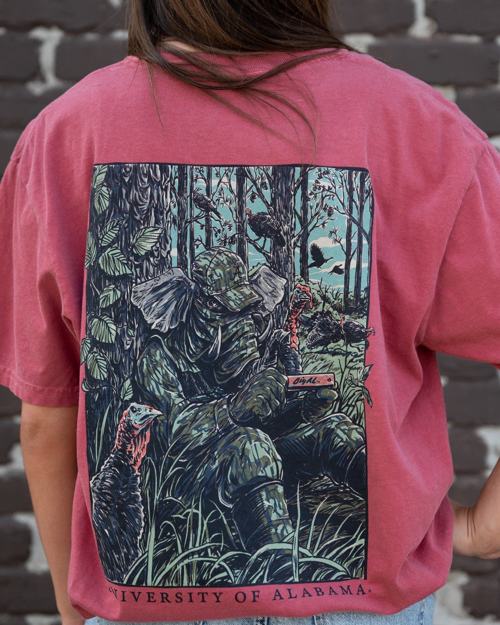 University of Alabama Big Al Turkey Call Comfort Colors Bay with an image of Big Al wearing hunting gear and sitting next to turkeys