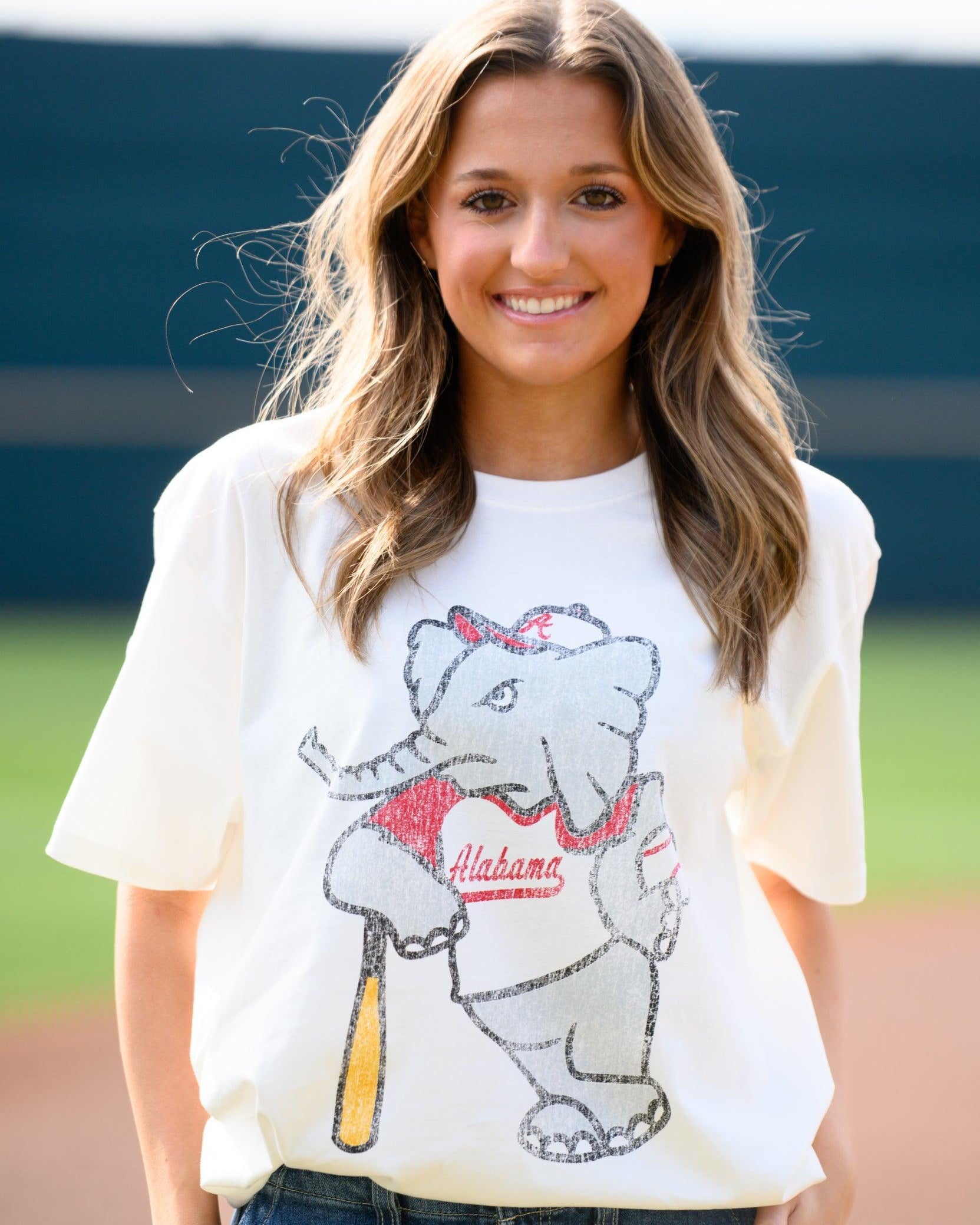 University of Alabama Big Al Vintage Baseball Ivory SoftShirts T-Shirt with an image of a vintage Big Al in a baseball uniform leaning against a baseball bat