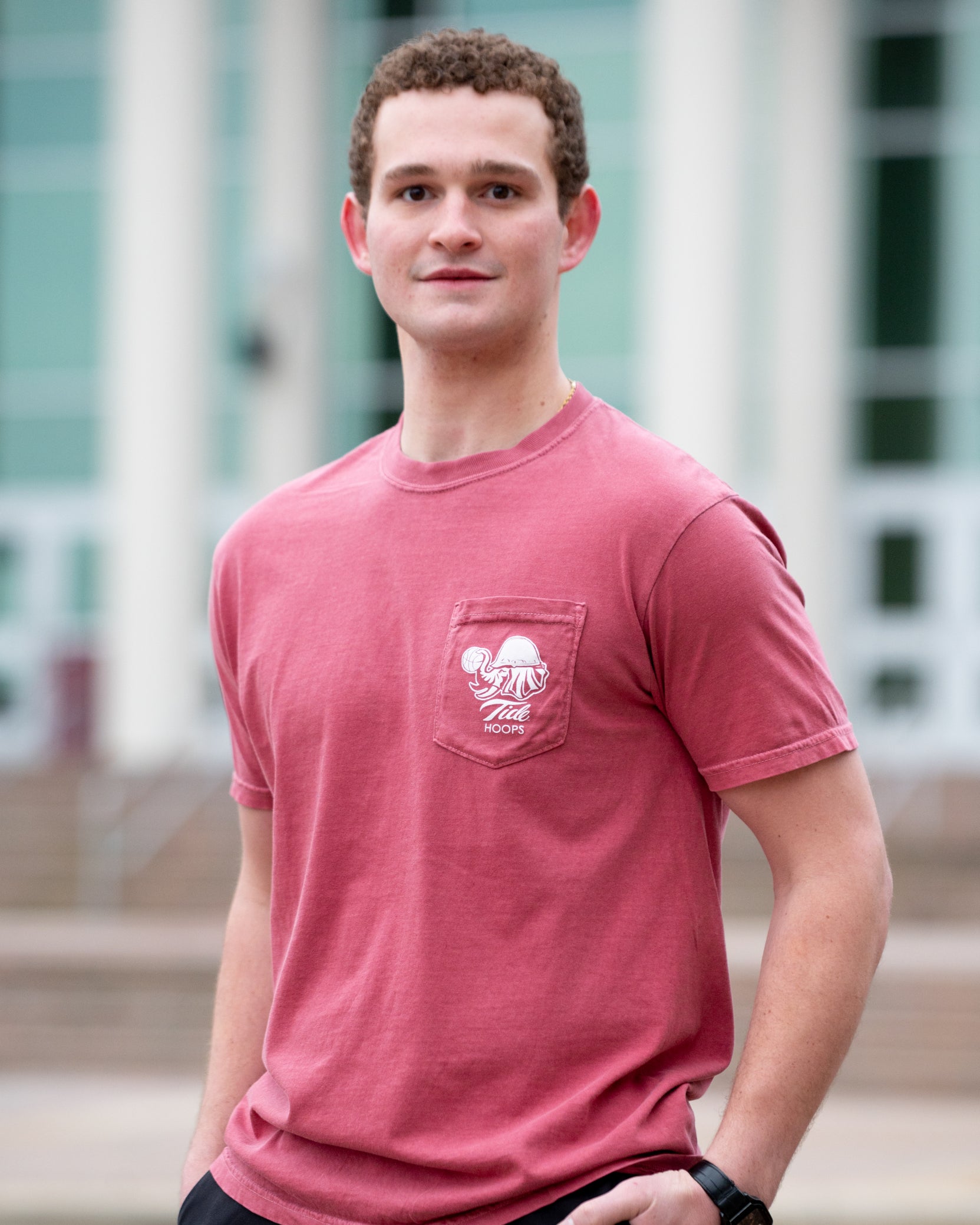 University of Alabama Red T-Shirt with Big Al wearing a hard hat and holding a basketball with his trunk to help spell the word “Hoops”