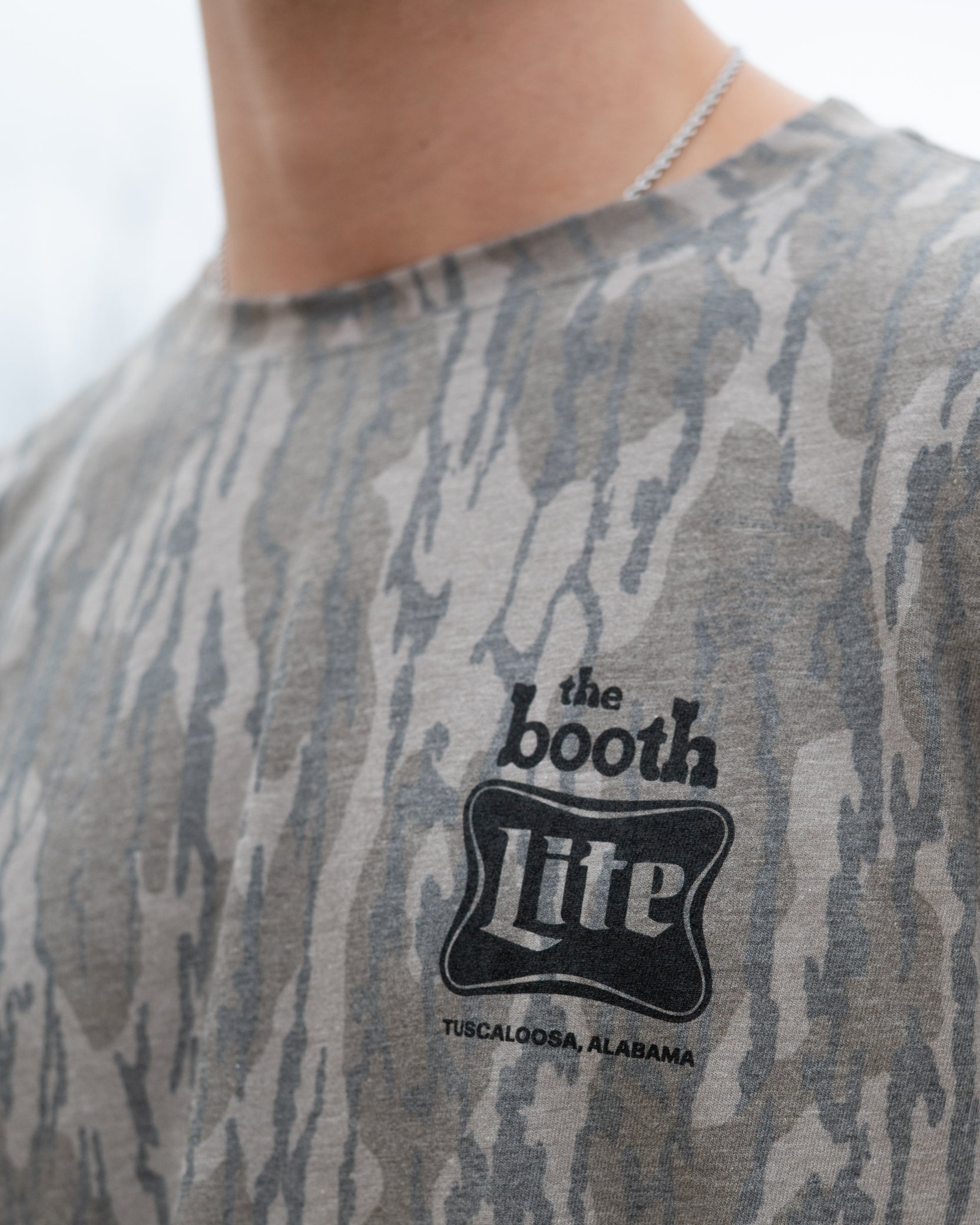The Booth Camo T-Shirt with Black The Booth Logo on the Chest and the Back