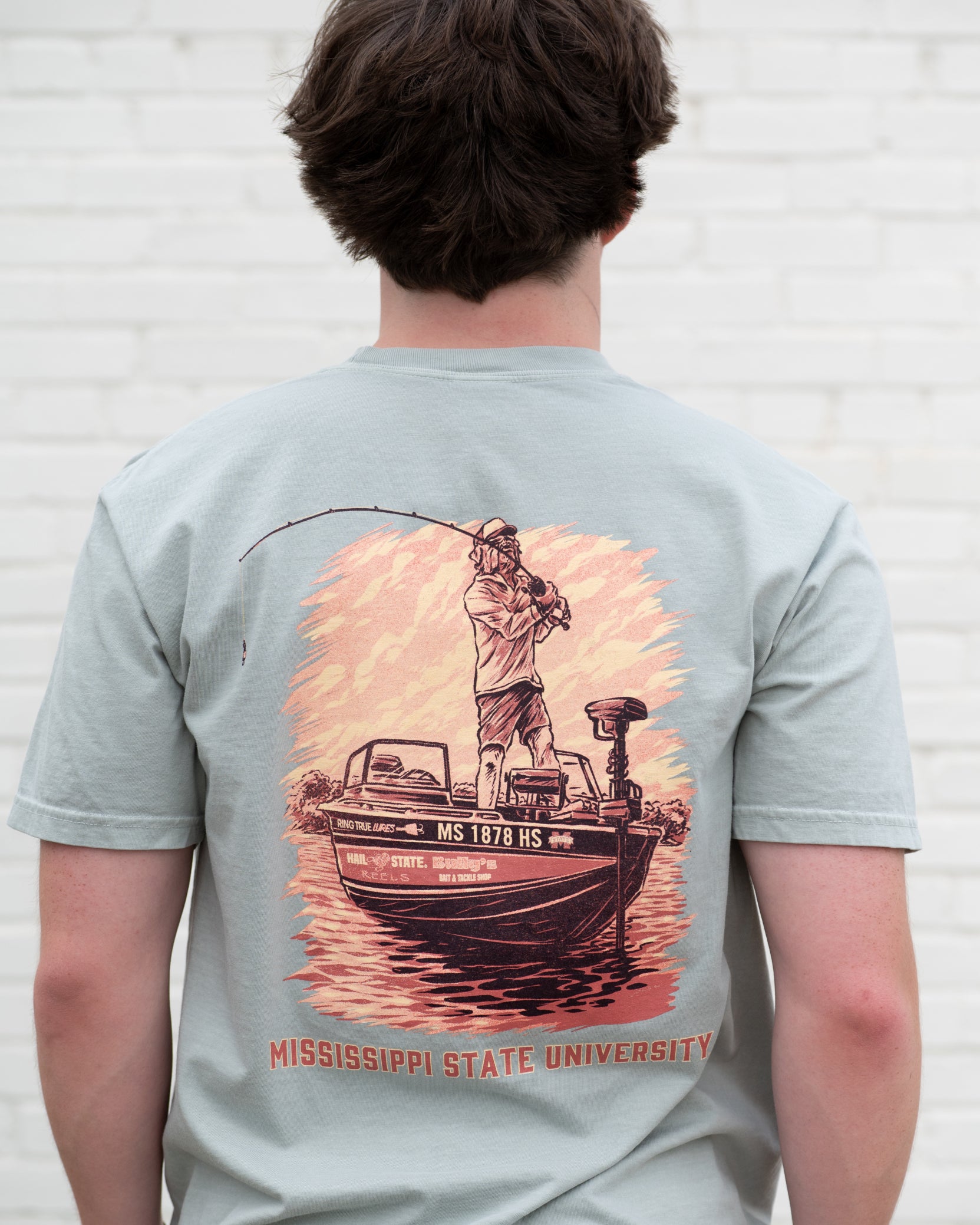 Mississippi State Light Green T-Shirt with an image of Bully bass fishing in a boat