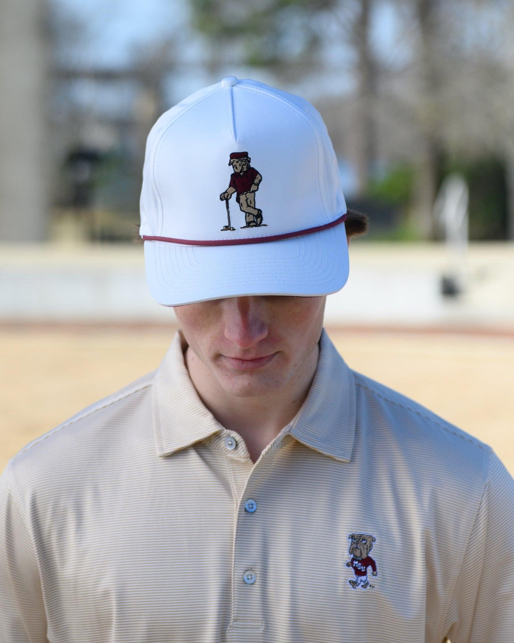 Mississippi State White Hat with an image of Bully leaning against a golf club