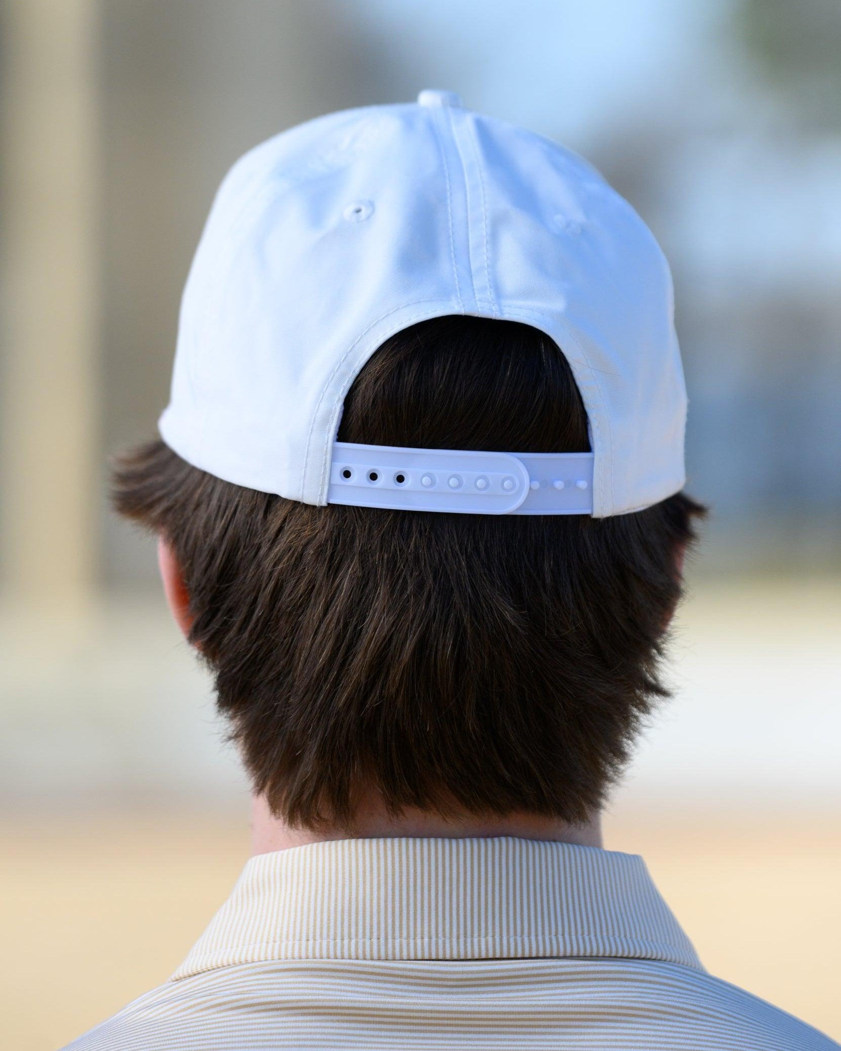 Mississippi State White Hat with an image of Bully leaning against a golf club
snapback