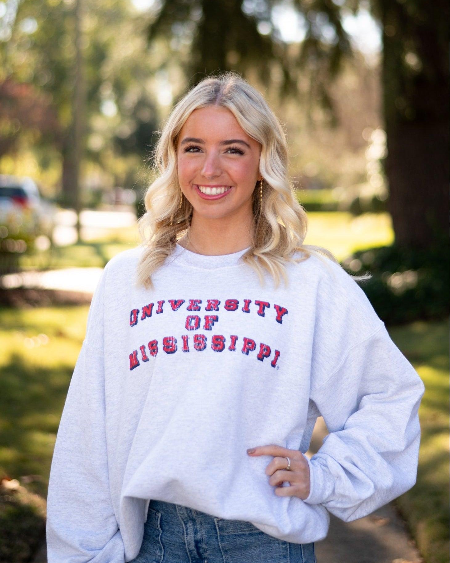 Ole Miss Light Grey Sweatshirt with Red text “University of Mississippi”