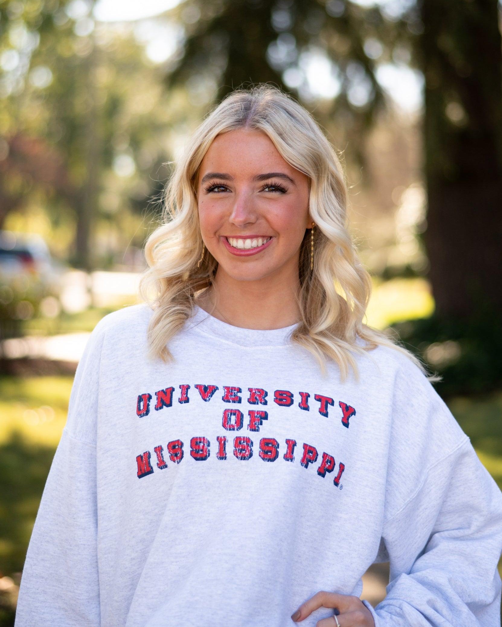 Ole Miss Light Grey Sweatshirt with Red text “University of Mississippi”