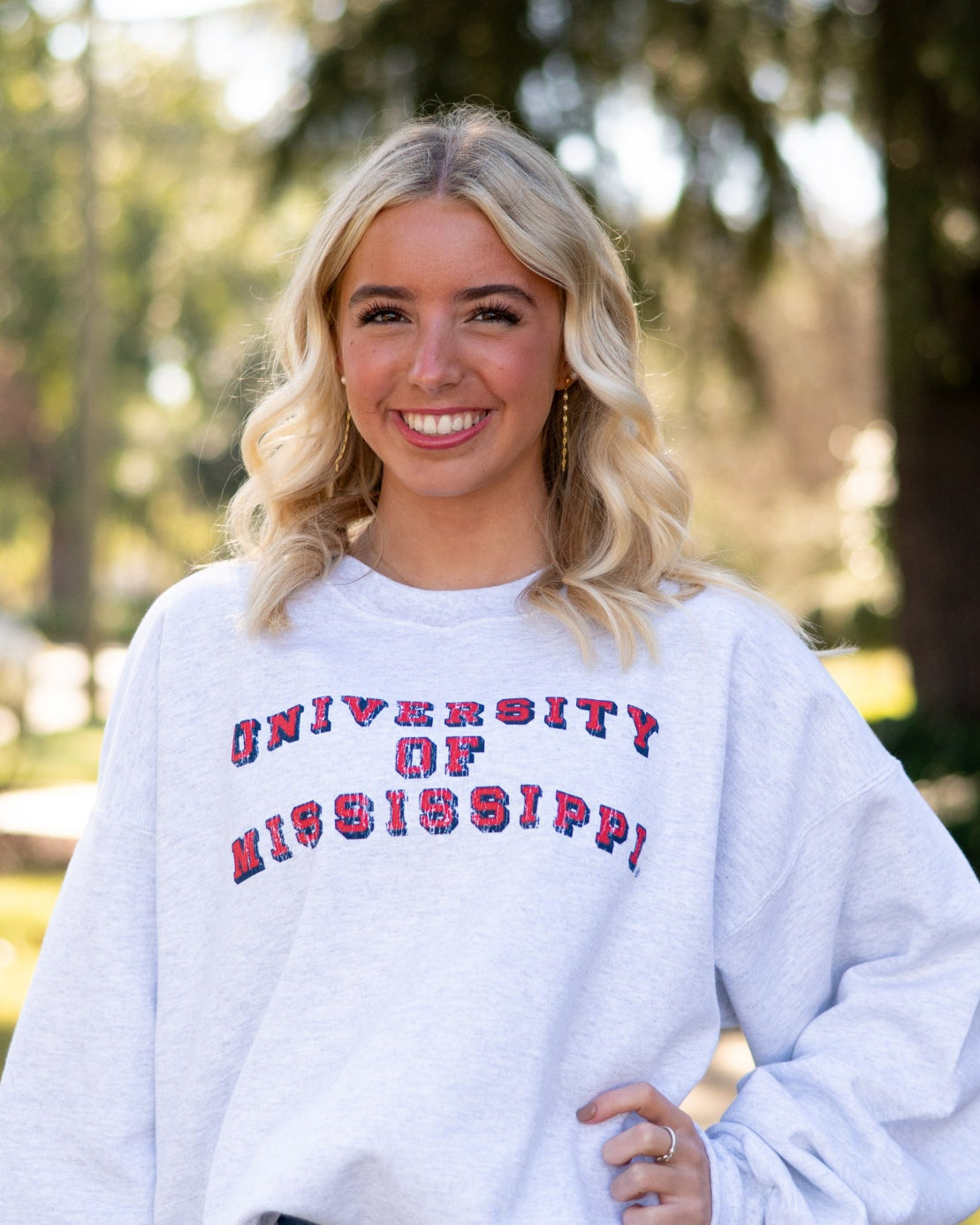Ole Miss Light Grey Sweatshirt with Red text “University of Mississippi”